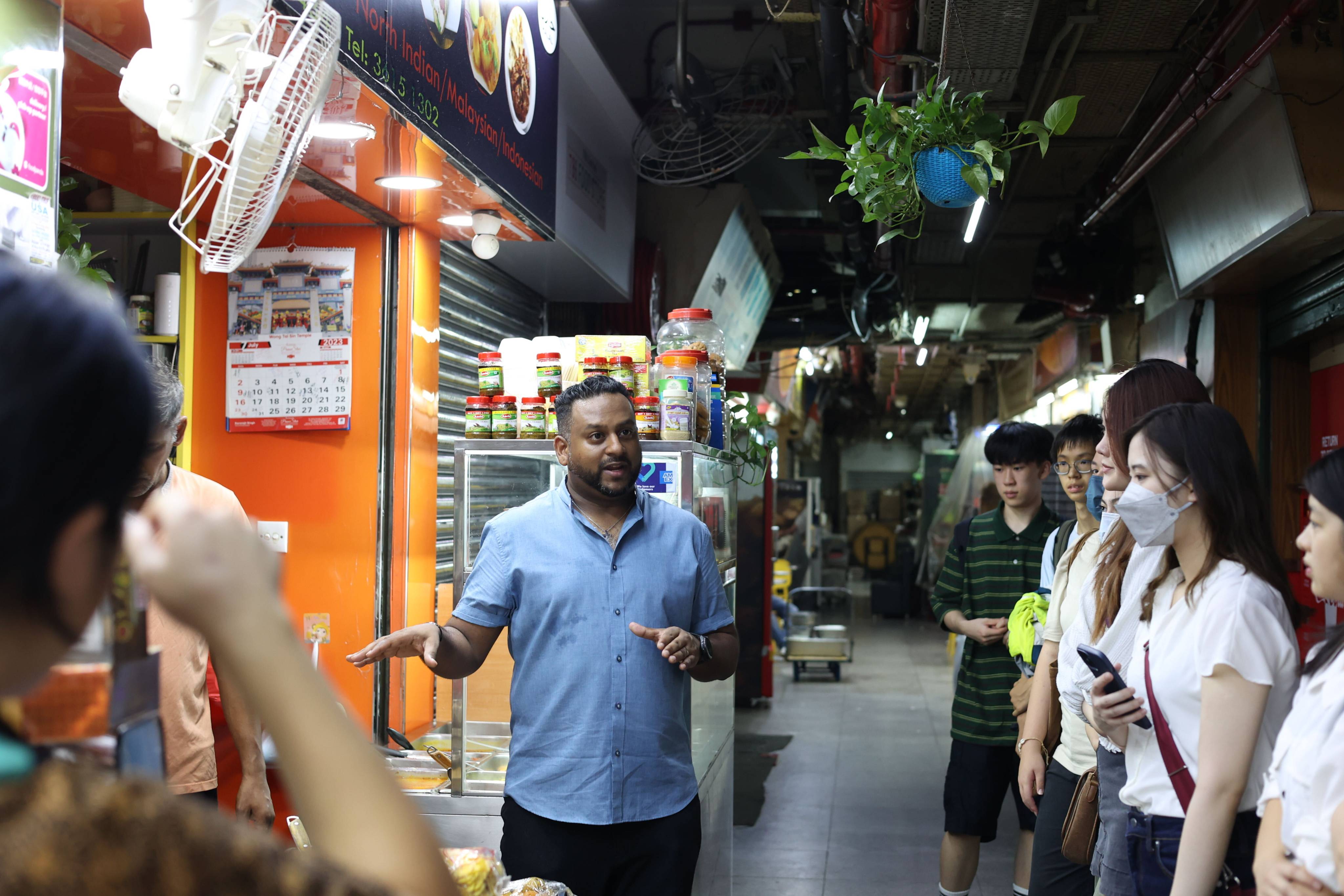 Students and Young Post interns tour Chungking Mansions, guided by Hong Kong’s first ethnic minority social worker, Jeffrey Andrews. Photo: Stanley Le