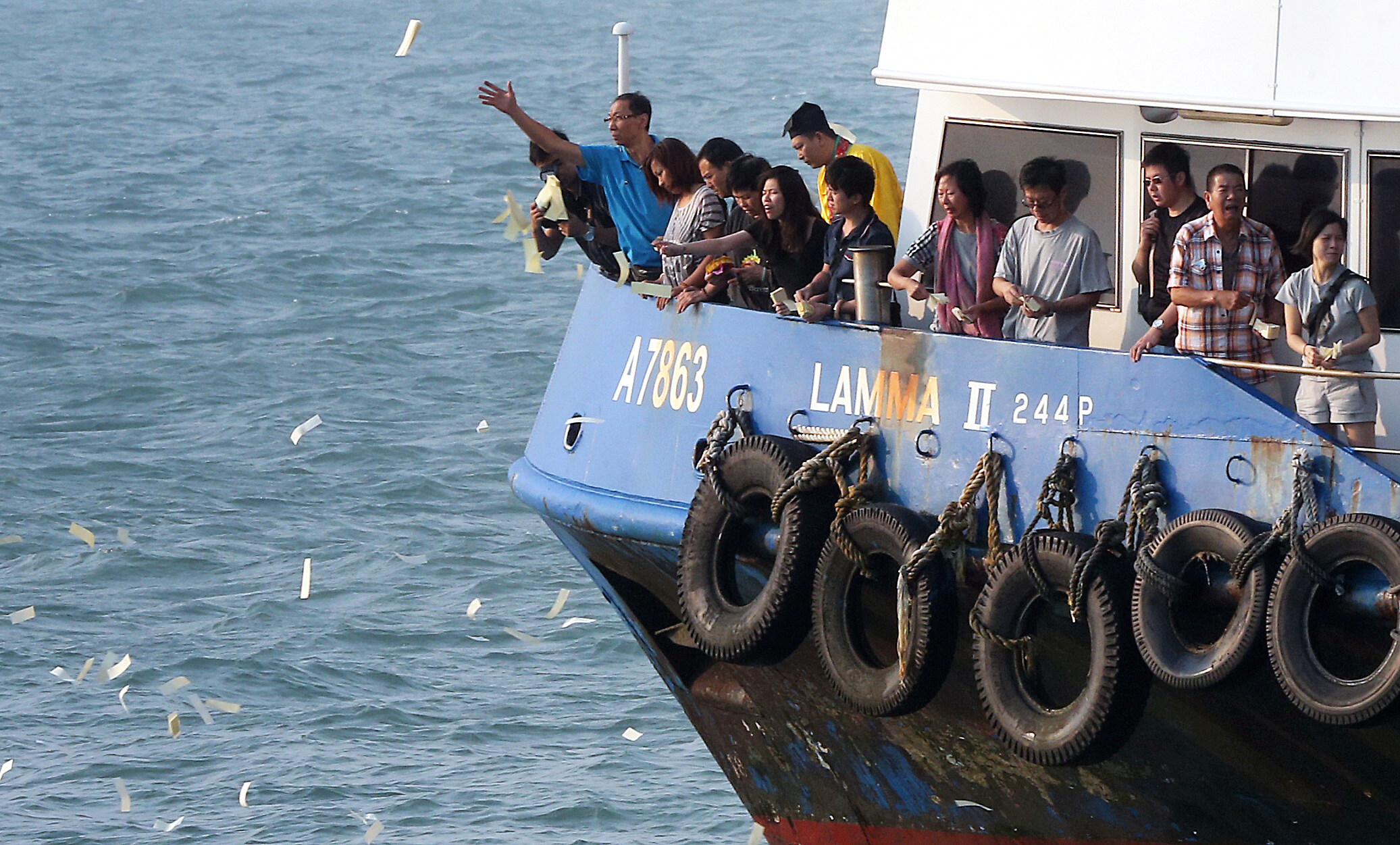 Family members perform rituals off Lamma Island following the horrific ferry disaster in October 2012. Relatives of the dead now will get the inquest they wanted. Photo: David Wong