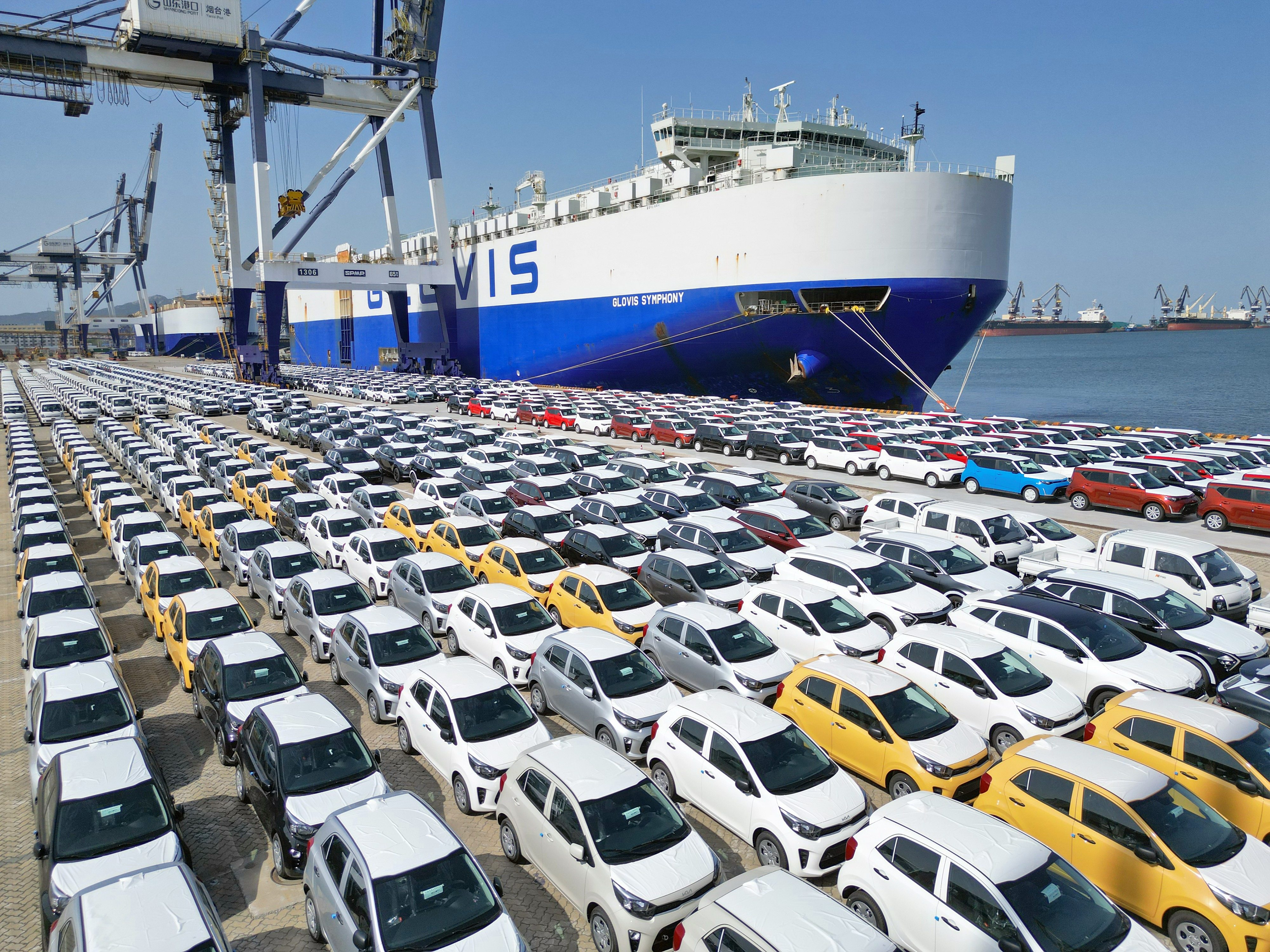 Cars being loaded for export are seen at Yantai Port in Shandong province on July 5. China’s exports slowed at the fastest pace since the start of the Covid-19 pandemic last month, adding pressure to Chinese policymakers. Photo: Xinhua