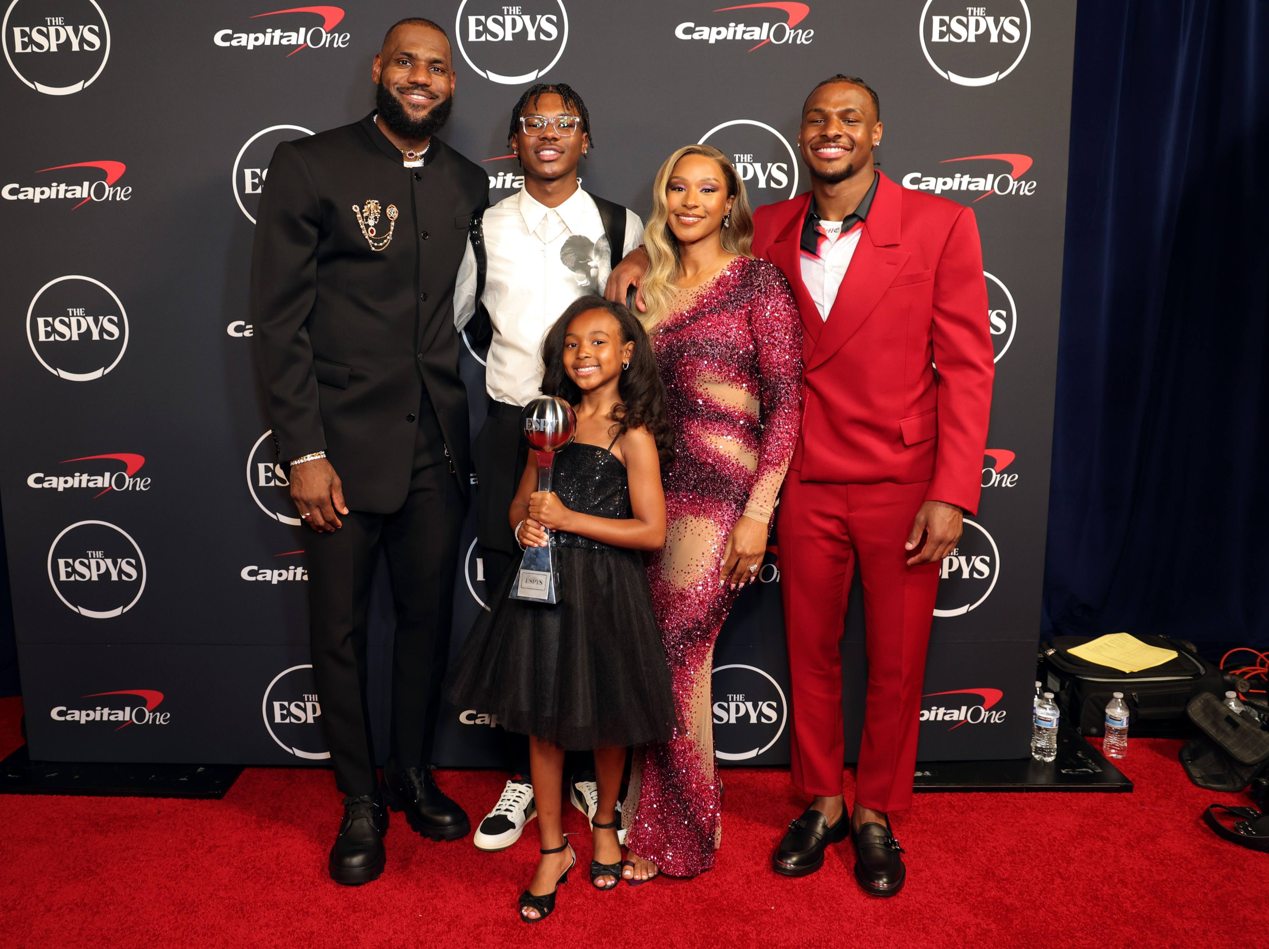 Basketball legend LeBron James with his kids Bryce, Zhuri and Bronny James, and his wife Savannah. Photo: Getty Images