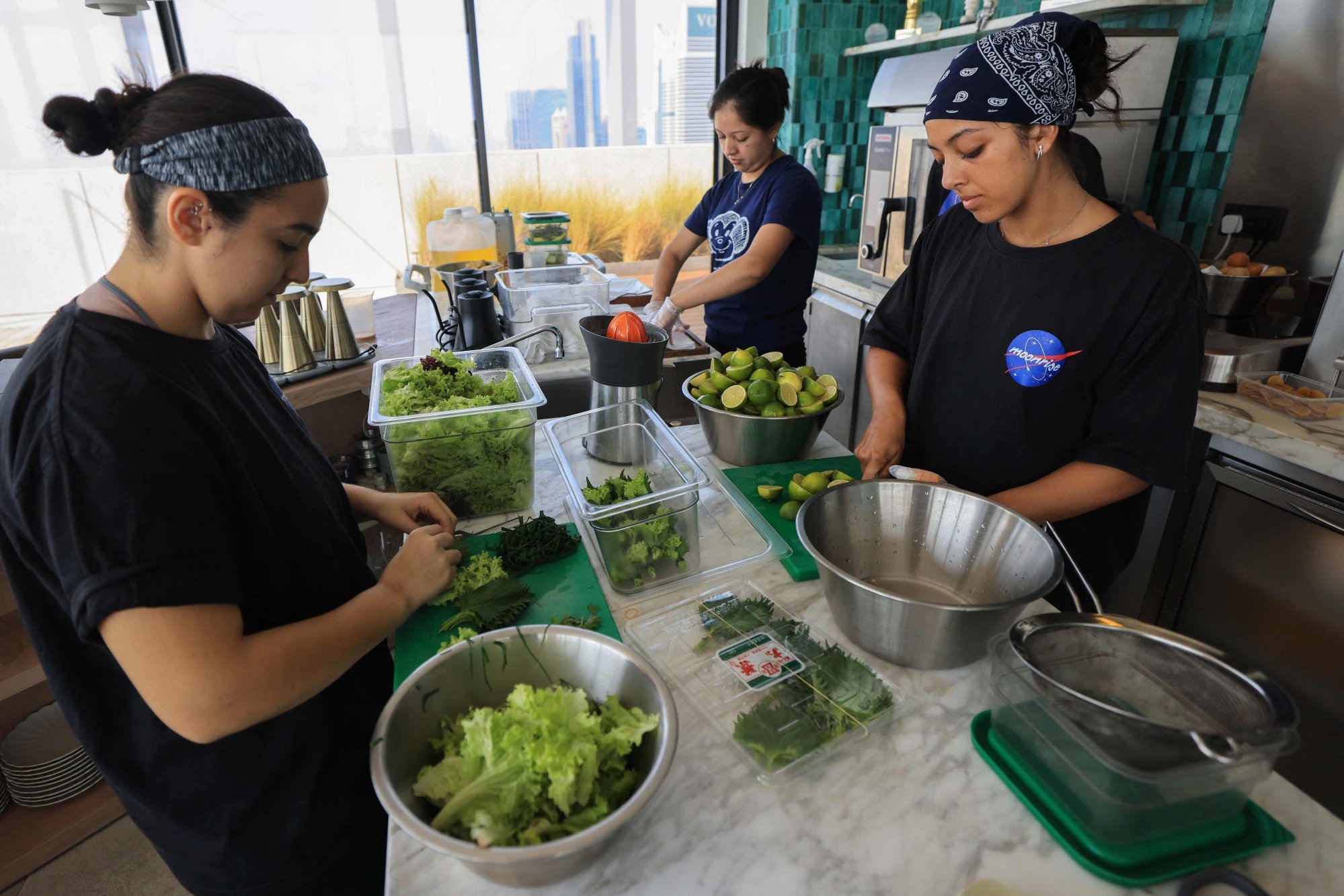 Chefs prepare dish ingredients at Moonrise. Being mostly desert, the UAE imports over 80 per cent of its food. Photo: AFP