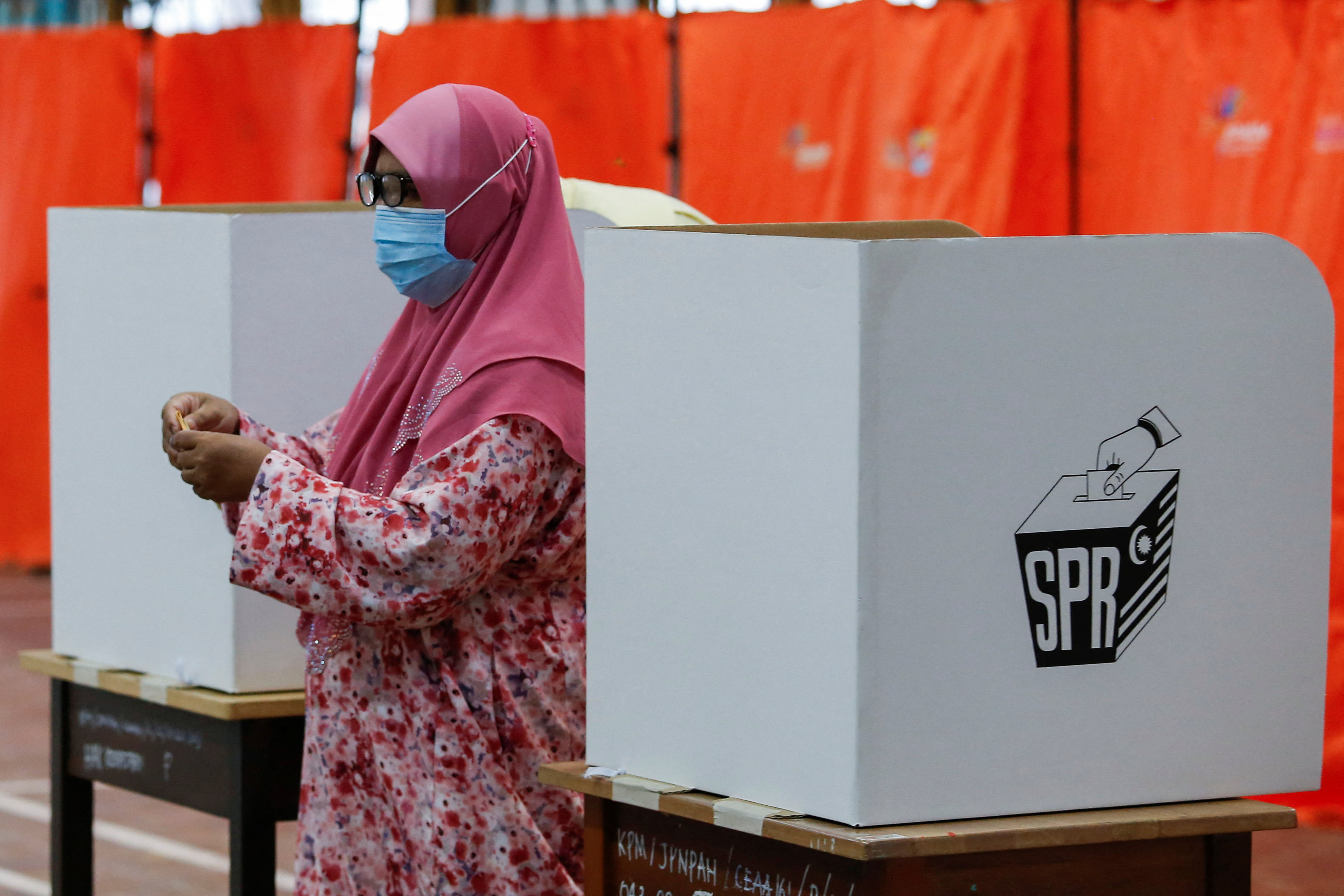 A woman casts her ballot during Malaysia’s 15th general election in November 2022. Malay voters shifted to a new Malay nationalist coalition in last year’s national polls. Photo: Reuters