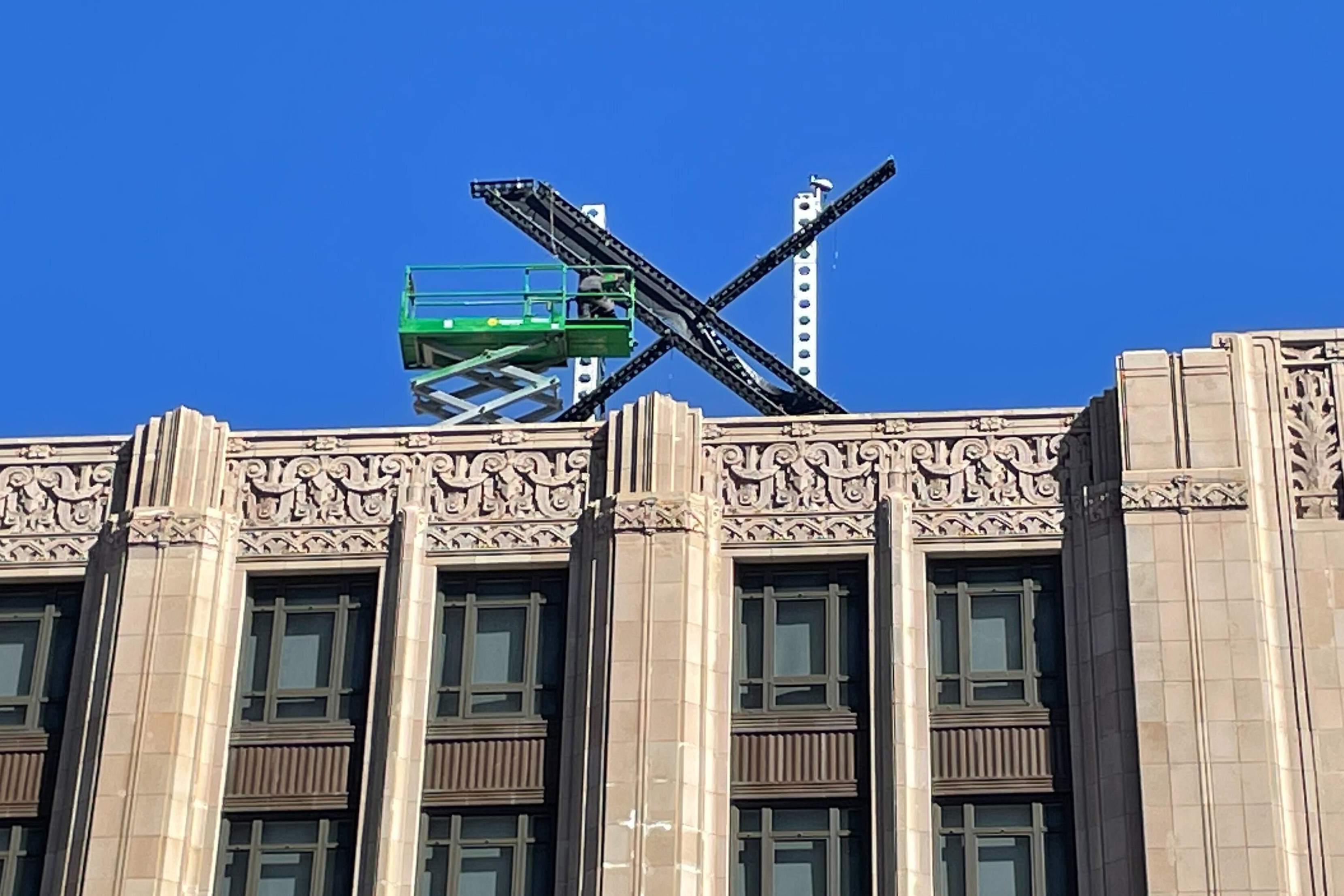 A large, metal “X” sign was installed on top of a San Francisco building formerly known as Twitter headquarters. Photo: AP
