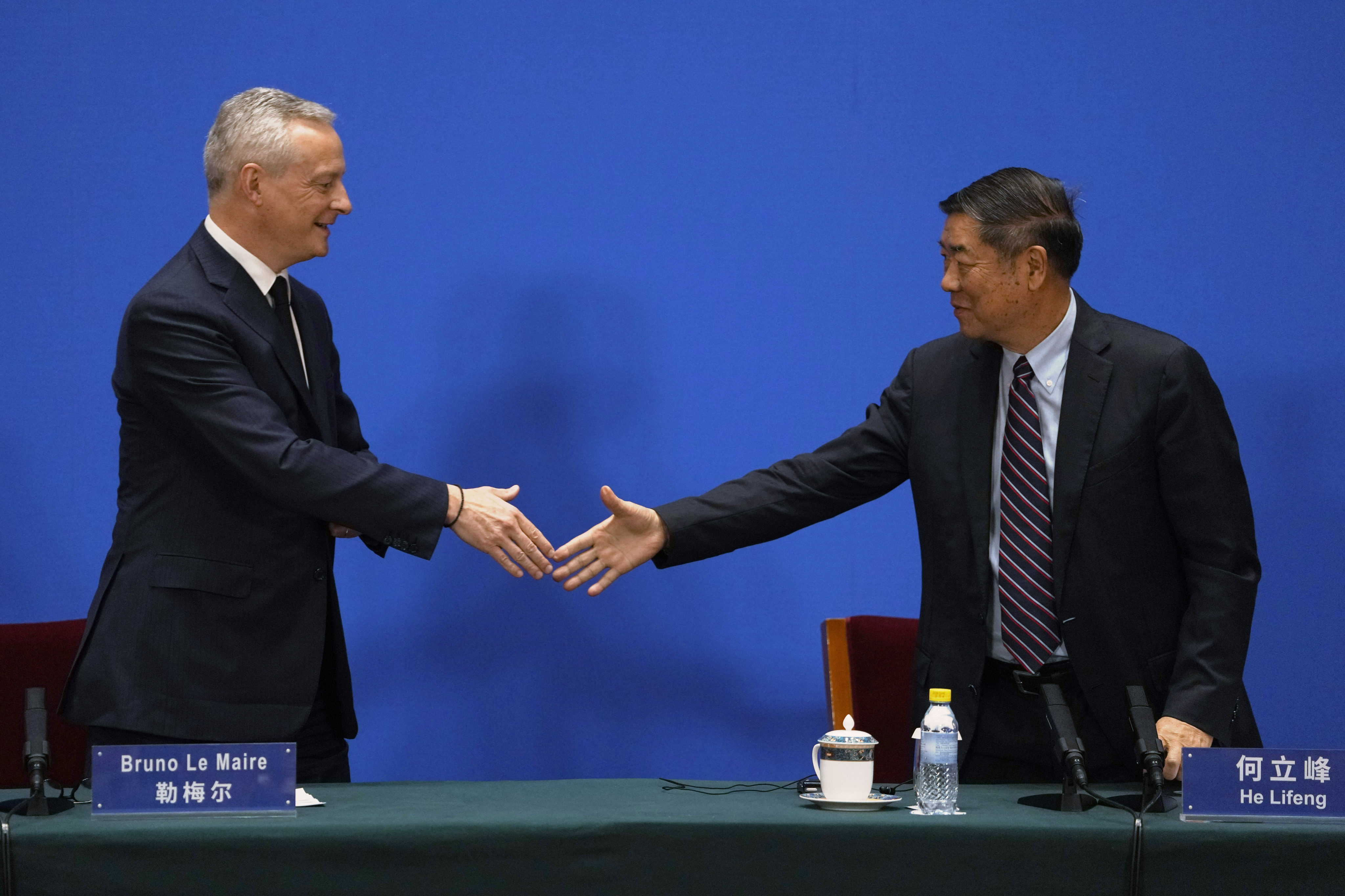 French Economy Minister Bruno Le Maire (left) and Chinese Vice-Premier He Lifeng hold talks at the Diaoyutai State Guest House in Beijing on Saturday. Photo: AP