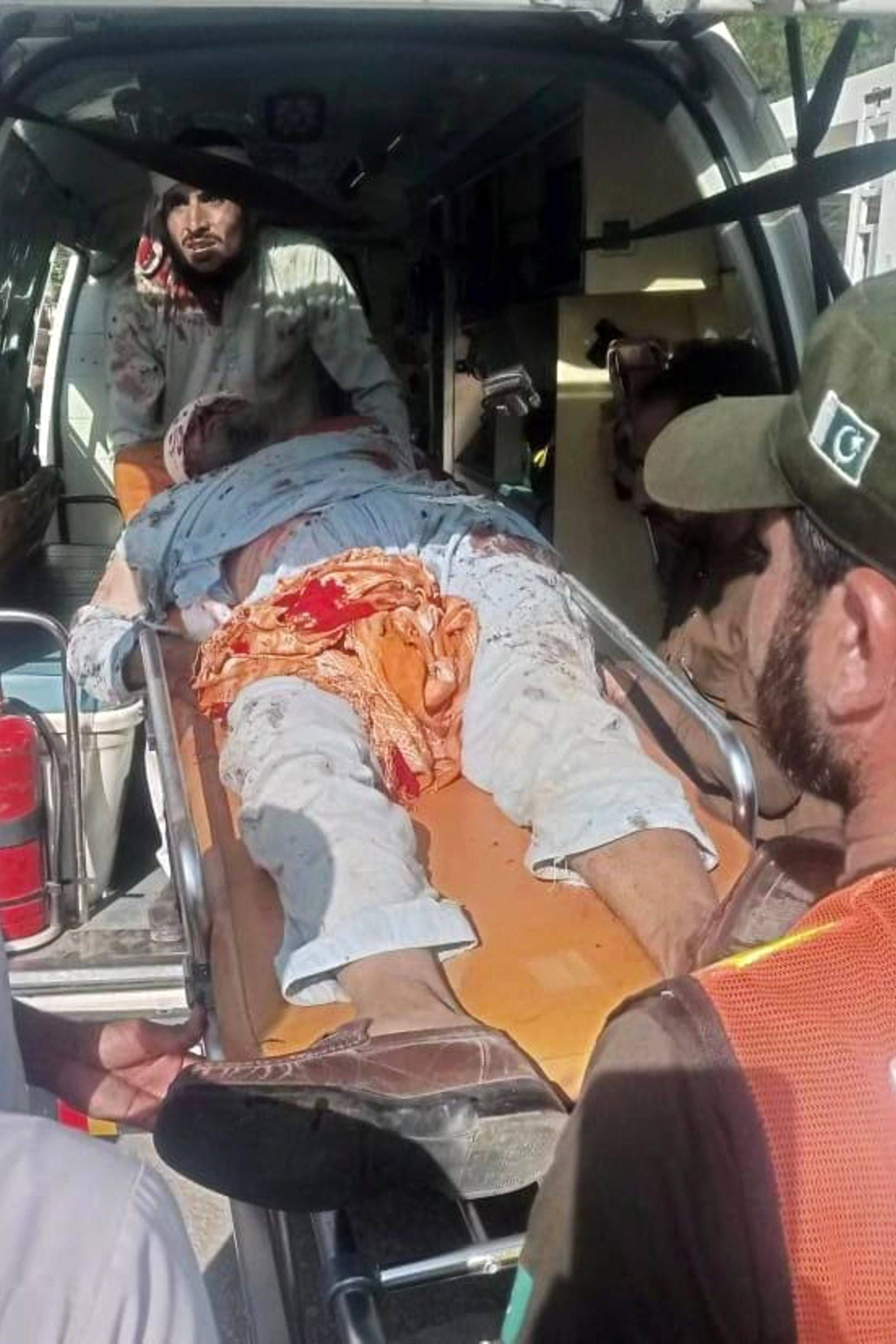 People carry an injured bomb blast victim in an ambulance. Photo: AFP