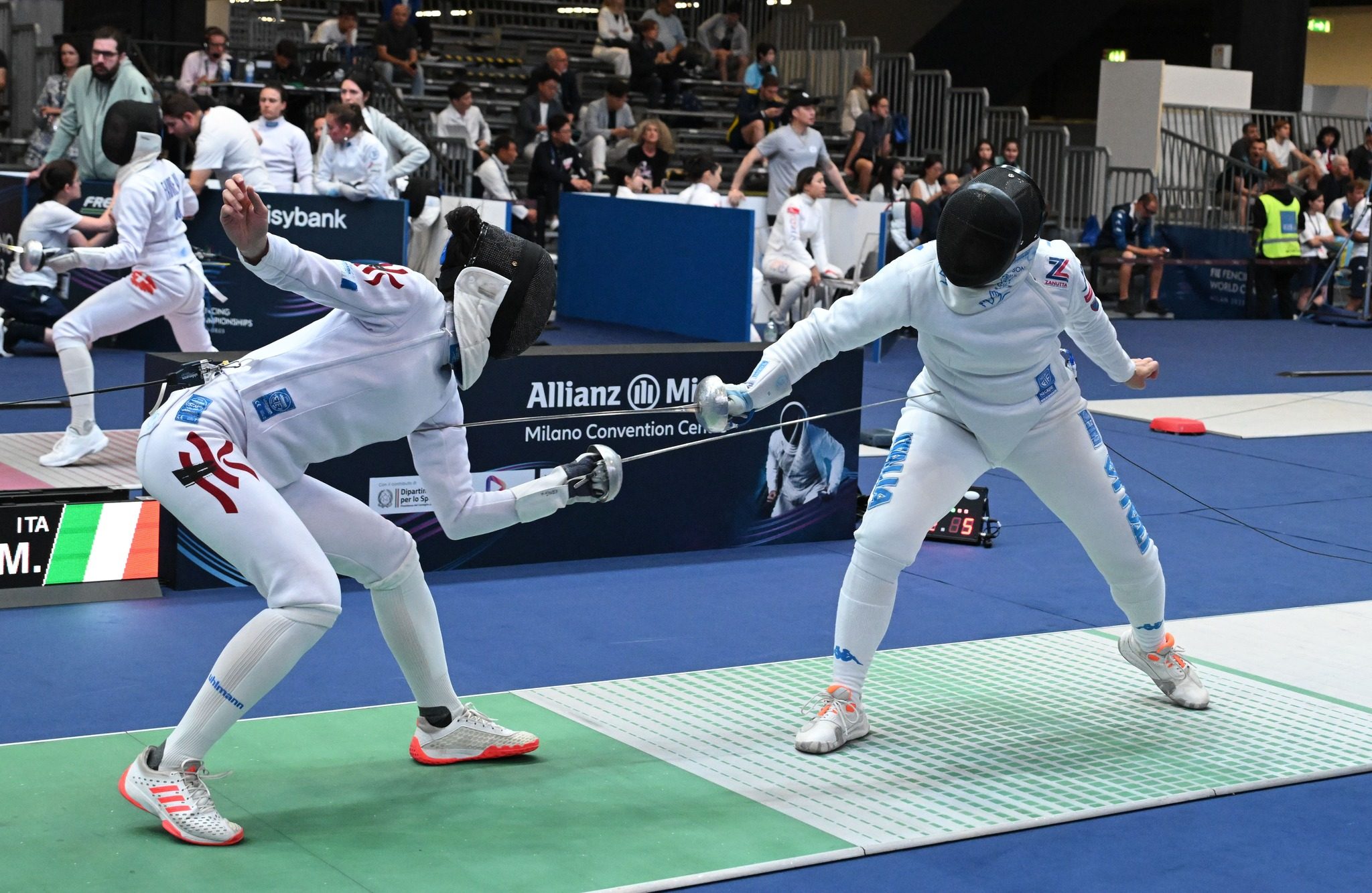 Vivian Kong (left) takes on Mara Navarria of Italy in the team epee. Photo: FIE