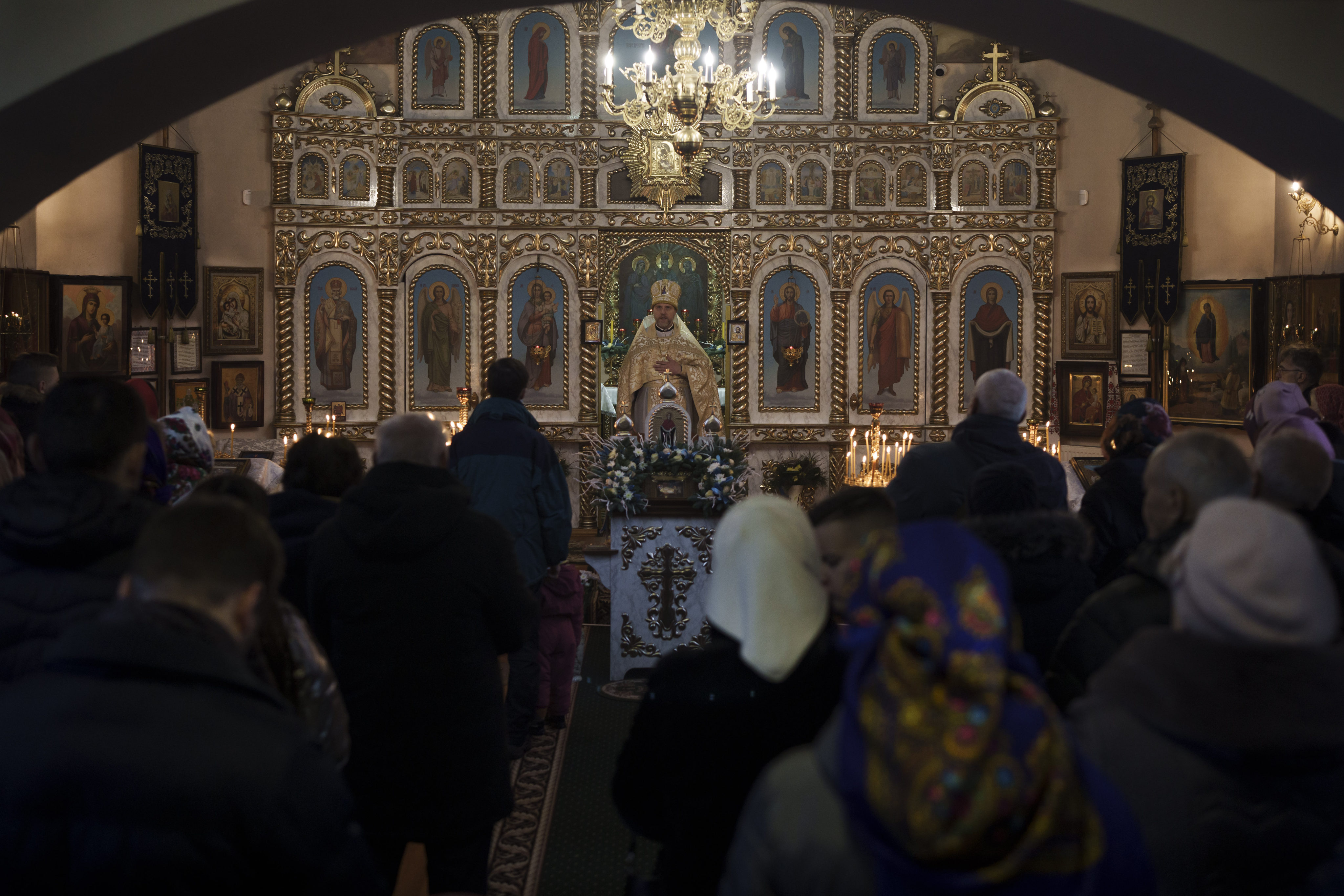 Ukrainians attend a Christmas mass at an Orthodox Church in Bobrytsia, Kyiv, Ukraine. Volodymyr Zelensky on Friday signed a law moving the official Christmas Day holiday to December 25 from January 7, the day when the Russian Orthodox Church observes it. Photo: AP