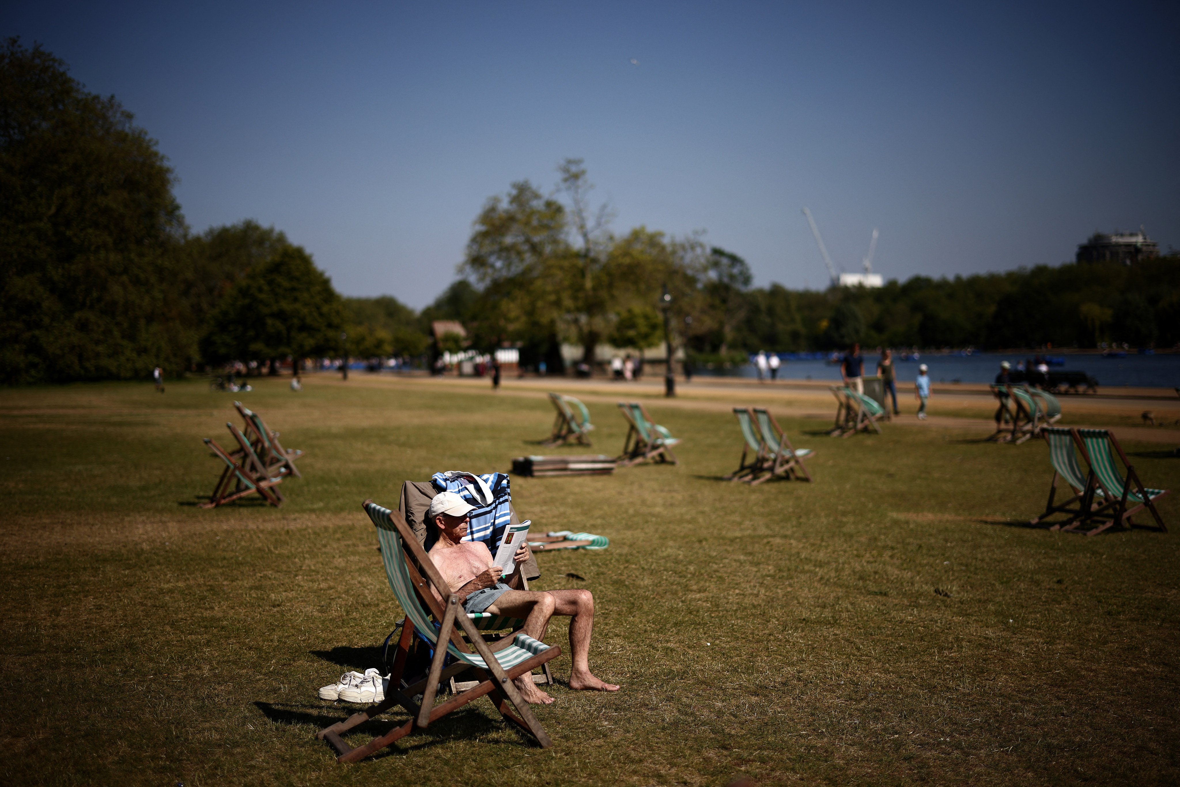 People sit in Hyde Park in central London amid this summer’s heatwave. Photo: AFP