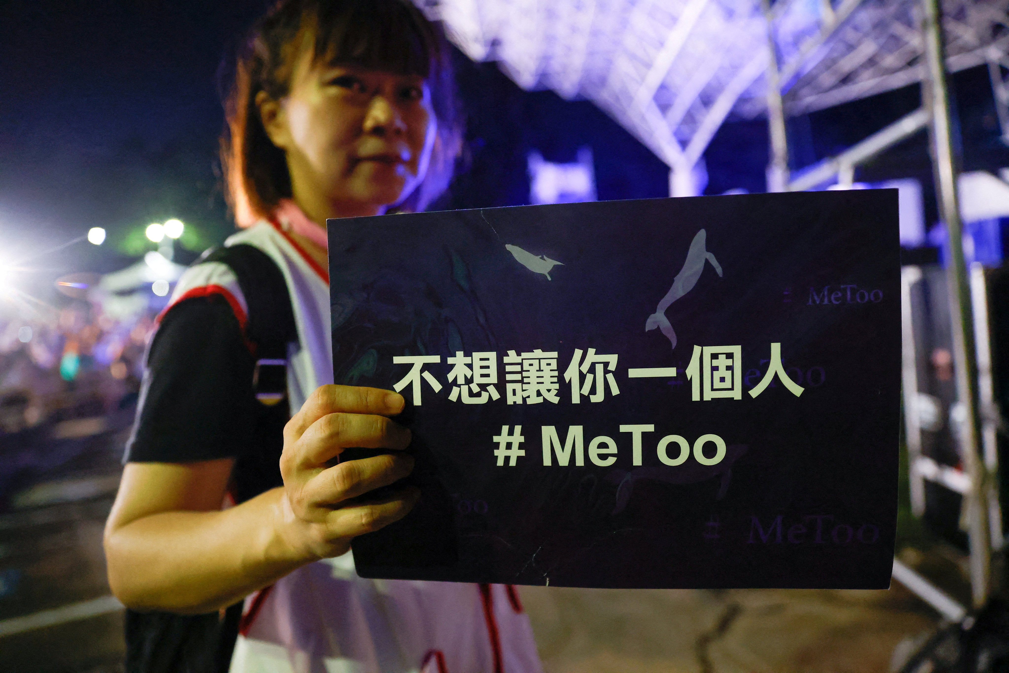A volunteer holds a placard at a concert to support the #MeToo movement in Taipei last month. Photo: Reuters