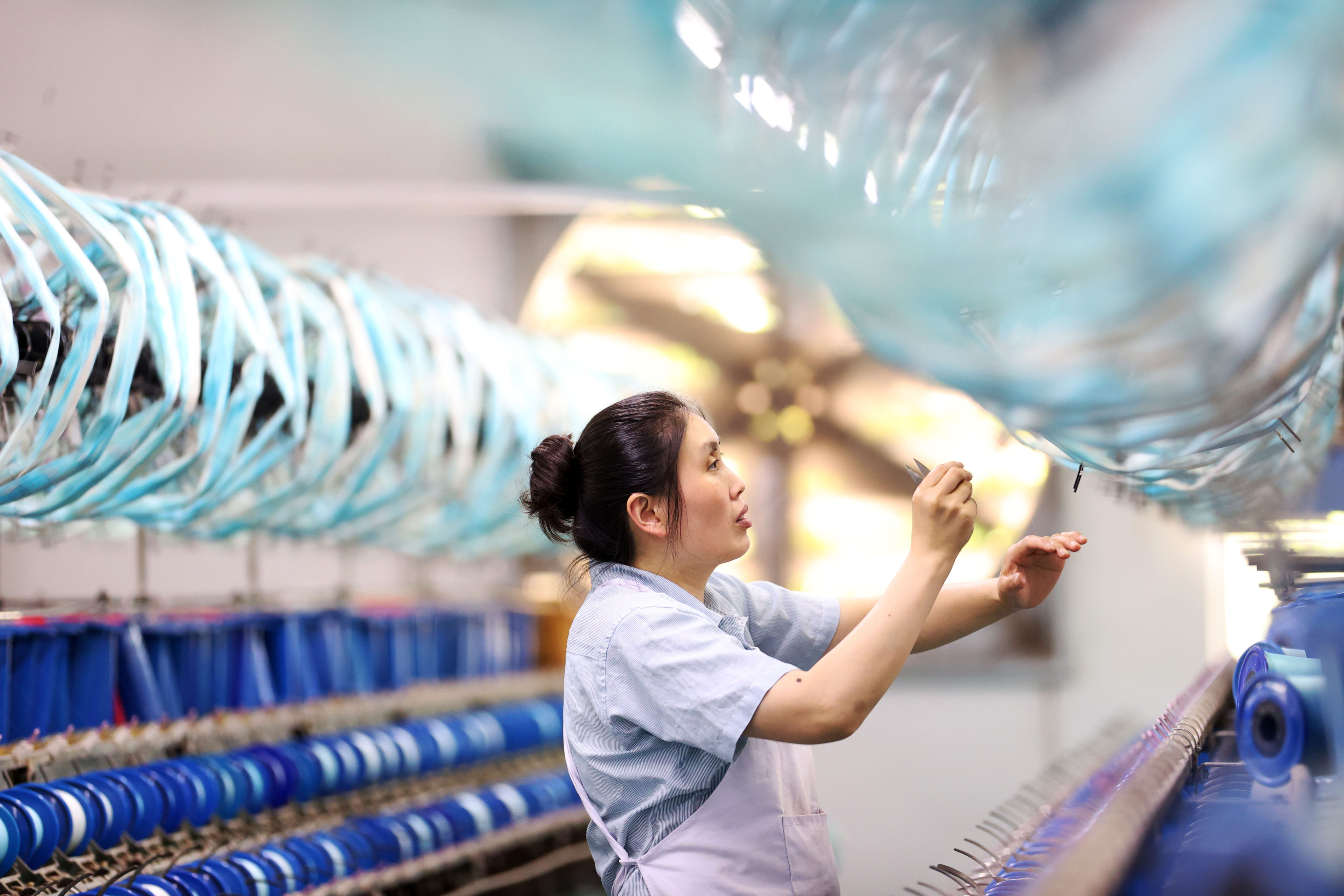 China’s official manufacturing purchasing managers’ index (PMI) rose to 49.3 in July from 49 in June. Photo: Xinhua