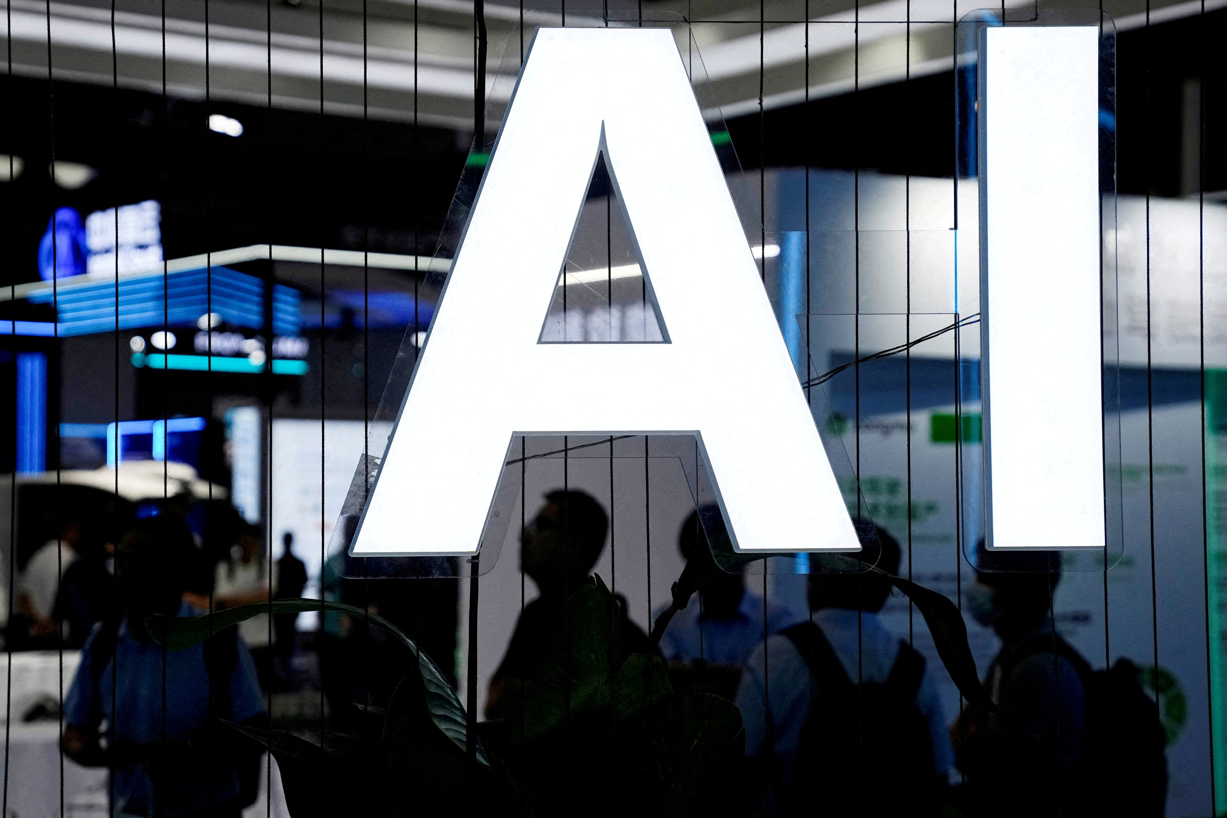 An AI sign is seen at the World Artificial Intelligence Conference in Shanghai on July 6. Progress on establishing global regulations and best practices on AI has been held back by geopolitical competition between China and the United States. Photo: Reuters