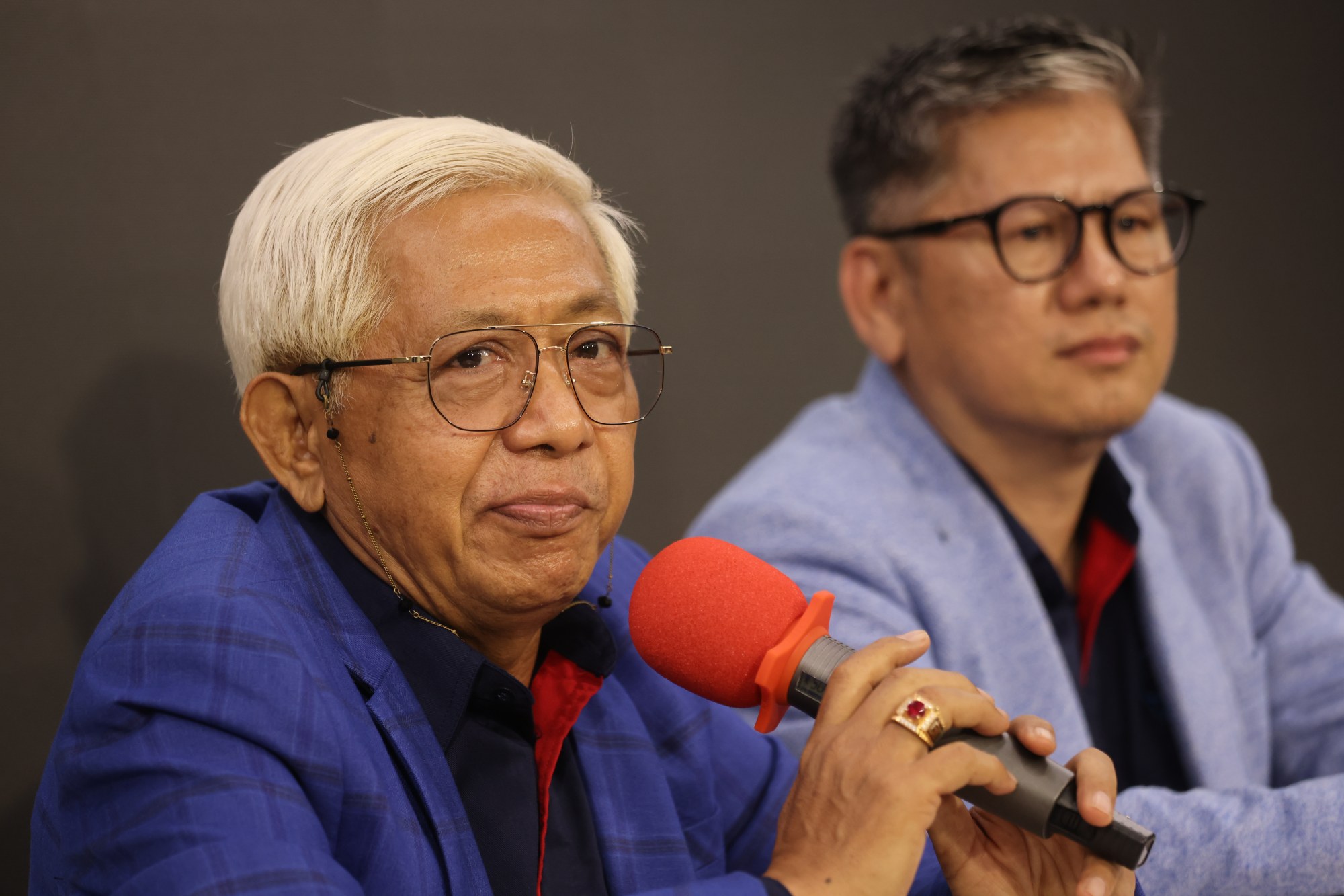 Aspataki representatives chairman Saiful Mashud (left) and vice-chairman Filius Yandono discuss fee changes involving Indonesian domestic helpers. Photo: Jonathan Wong