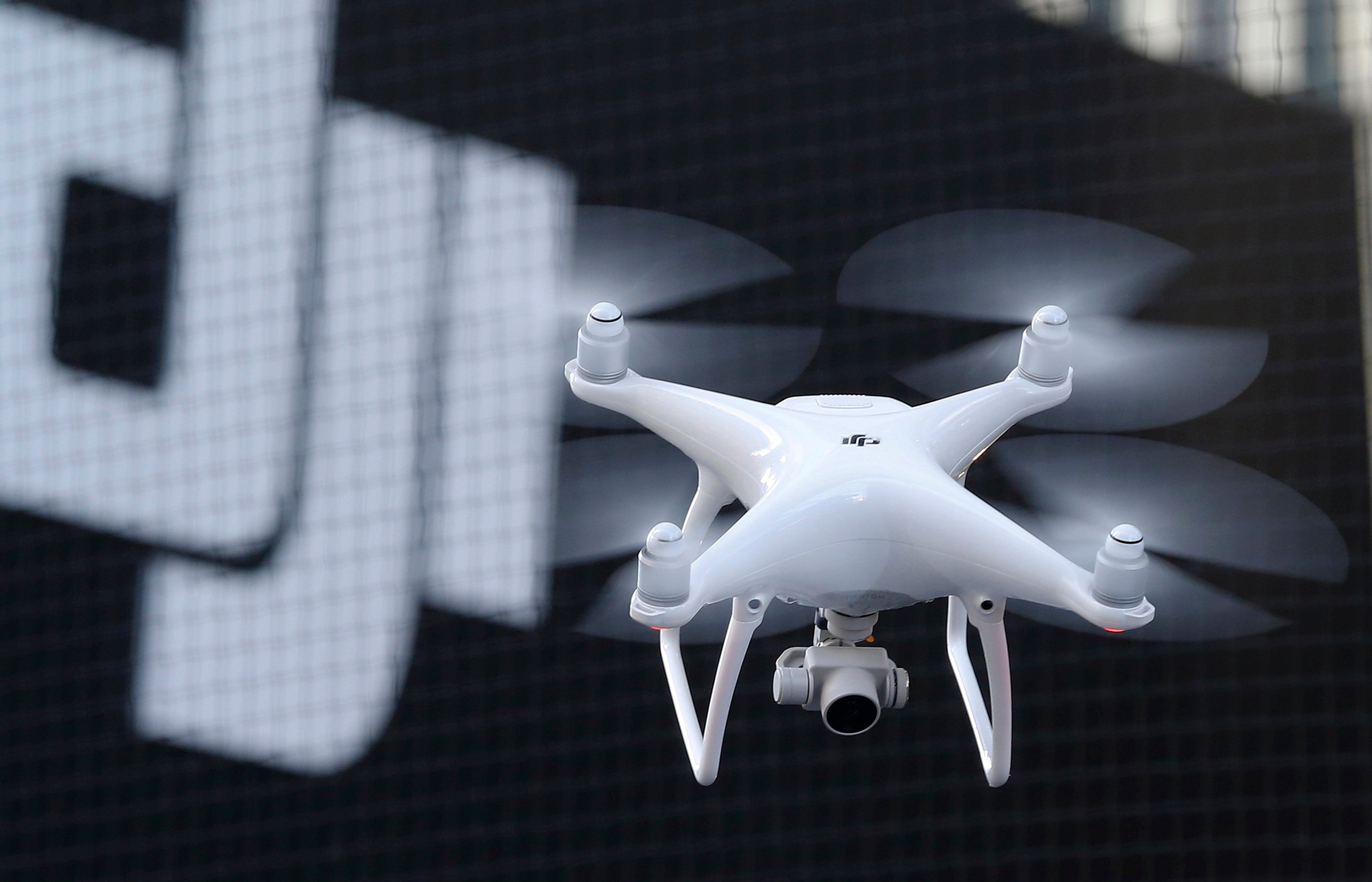 A Phantom 4 drone from DJI flies during a demonstration flight in Tokyo,  March 3, 2016. Photo: AP 