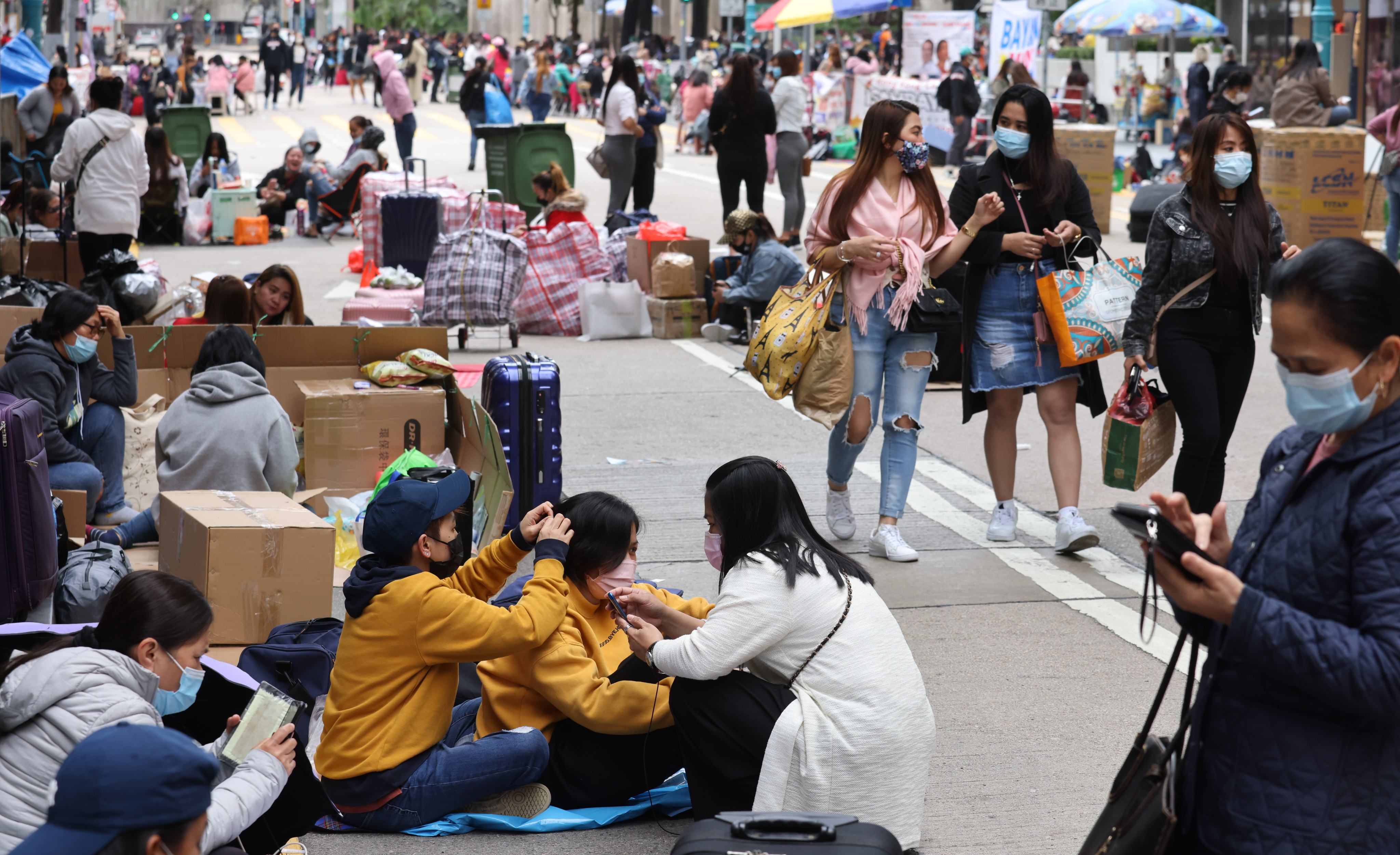 Domestic helpers from overseas gather in Central on a day off. Photo: Nora Tam