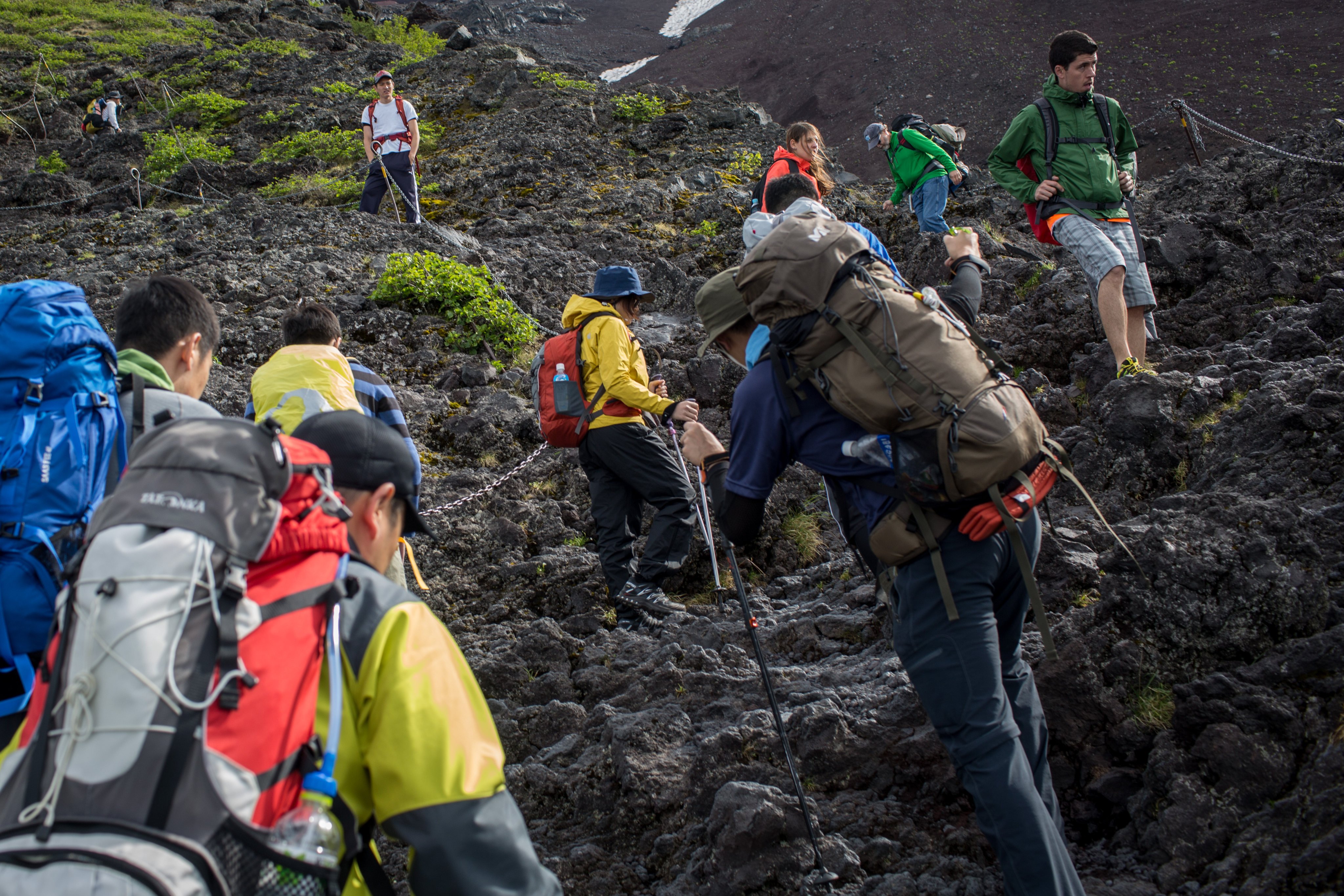 Climbers hike up Mount Fuji, Japan’s highest peak. Congestion is common on trails during the summer climbing season, but could be worse than ever in 2023. Climbers typically rest in mountain huts, but demand for beds will exceed supply this year, part of a general accommodation crunch in Japan. Photo: Chris McGrath/Getty Images