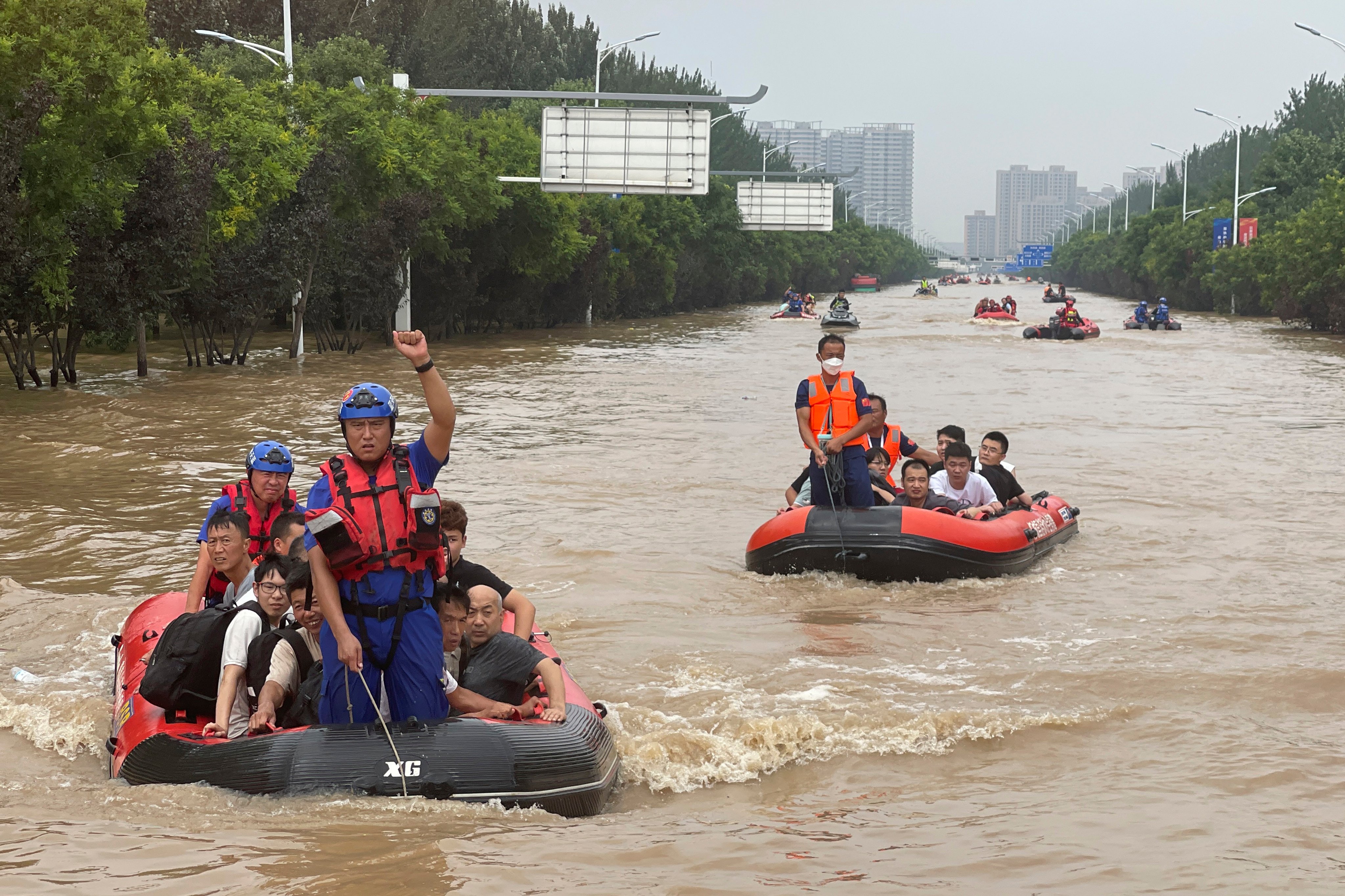 Residents are evacuated on rubber boats in Zhuozhou, in northern China’s Hebei province near Beijing. Photo: AP