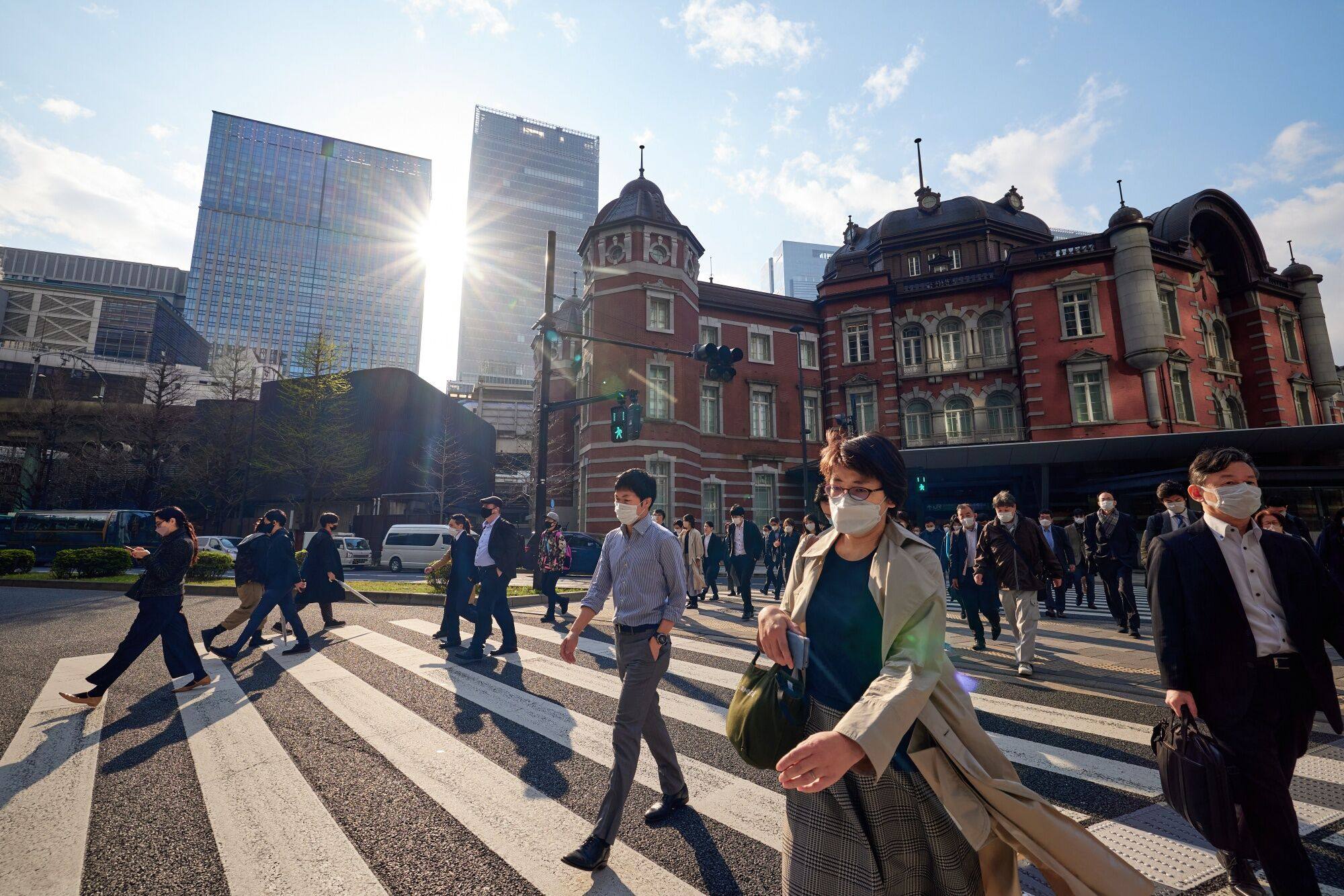 Morning commuters head away from Tokyo train station in Japan on March 30. Photo: Bloomberg