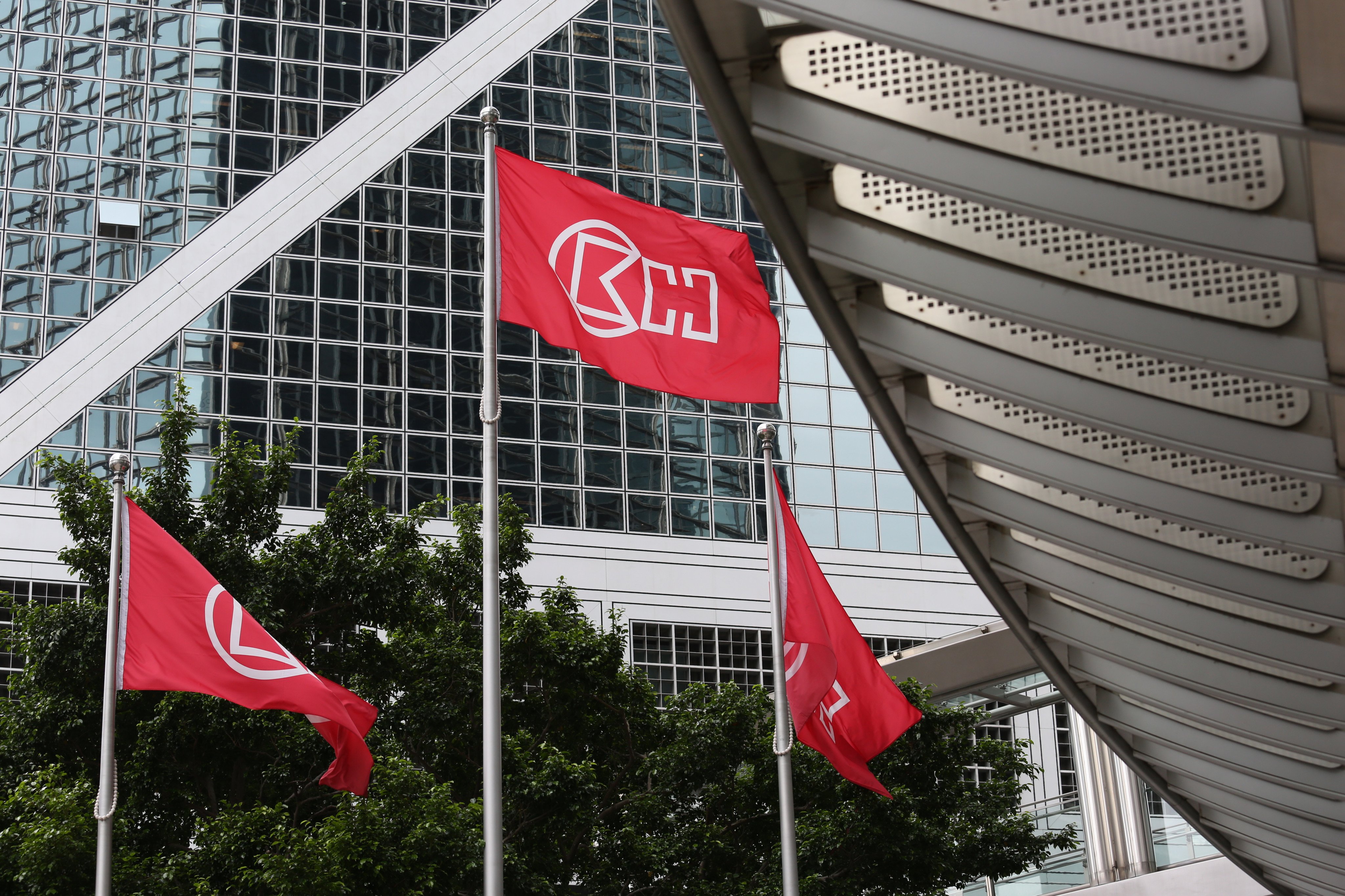 Flags of CK Hutchison outside the Cheung Kong Centre in Central. The conglomerate said net profits plunged 41 per cent to HK$11.2 billion (US$1.43 billion).  Photo: SCMP Pictures