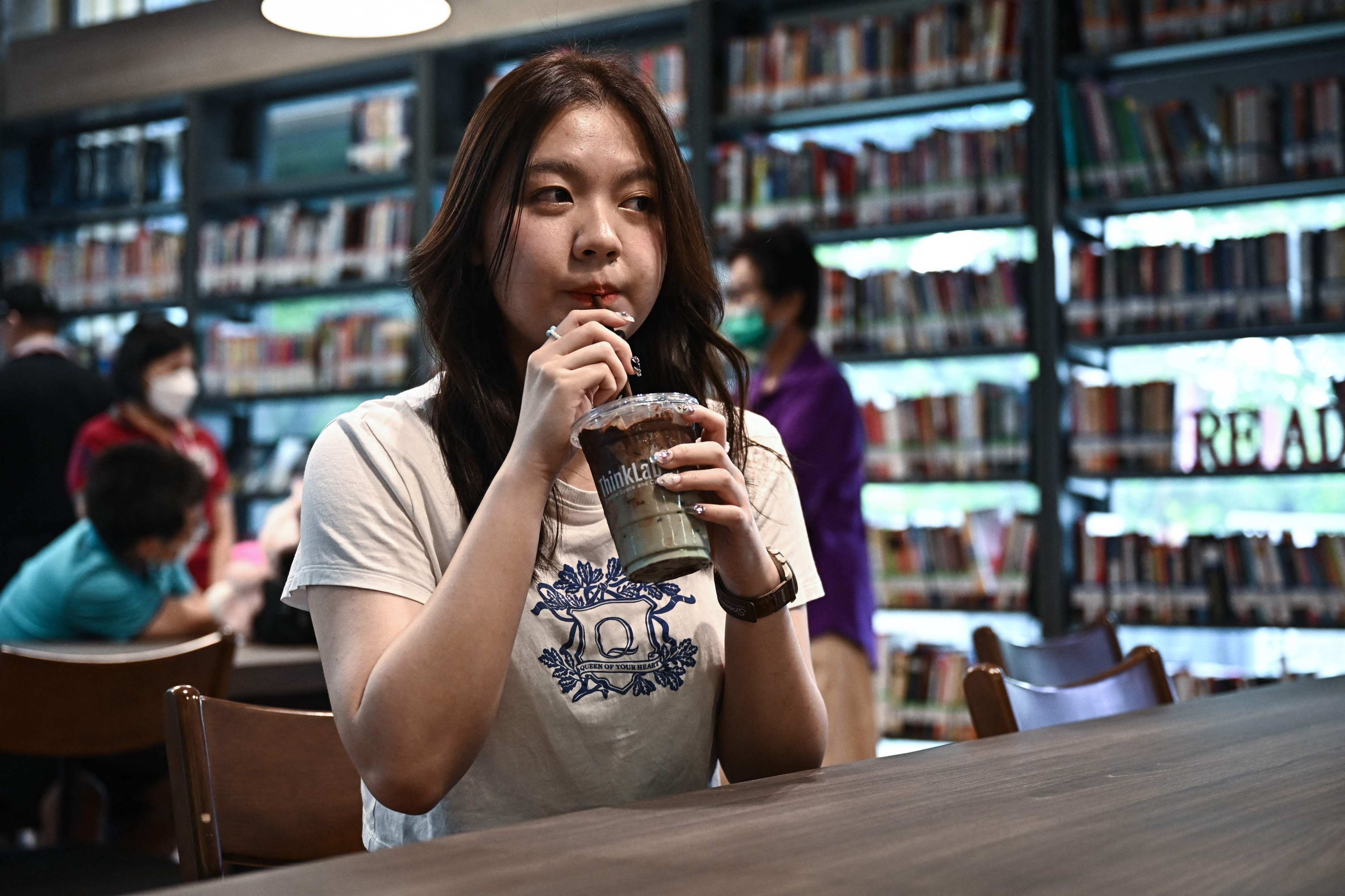 A customer drinking an iced chocolate-mint drink at the ThinkLab cafe in Pheu Thai party’s Bangkok headquarters. Photo: AFP