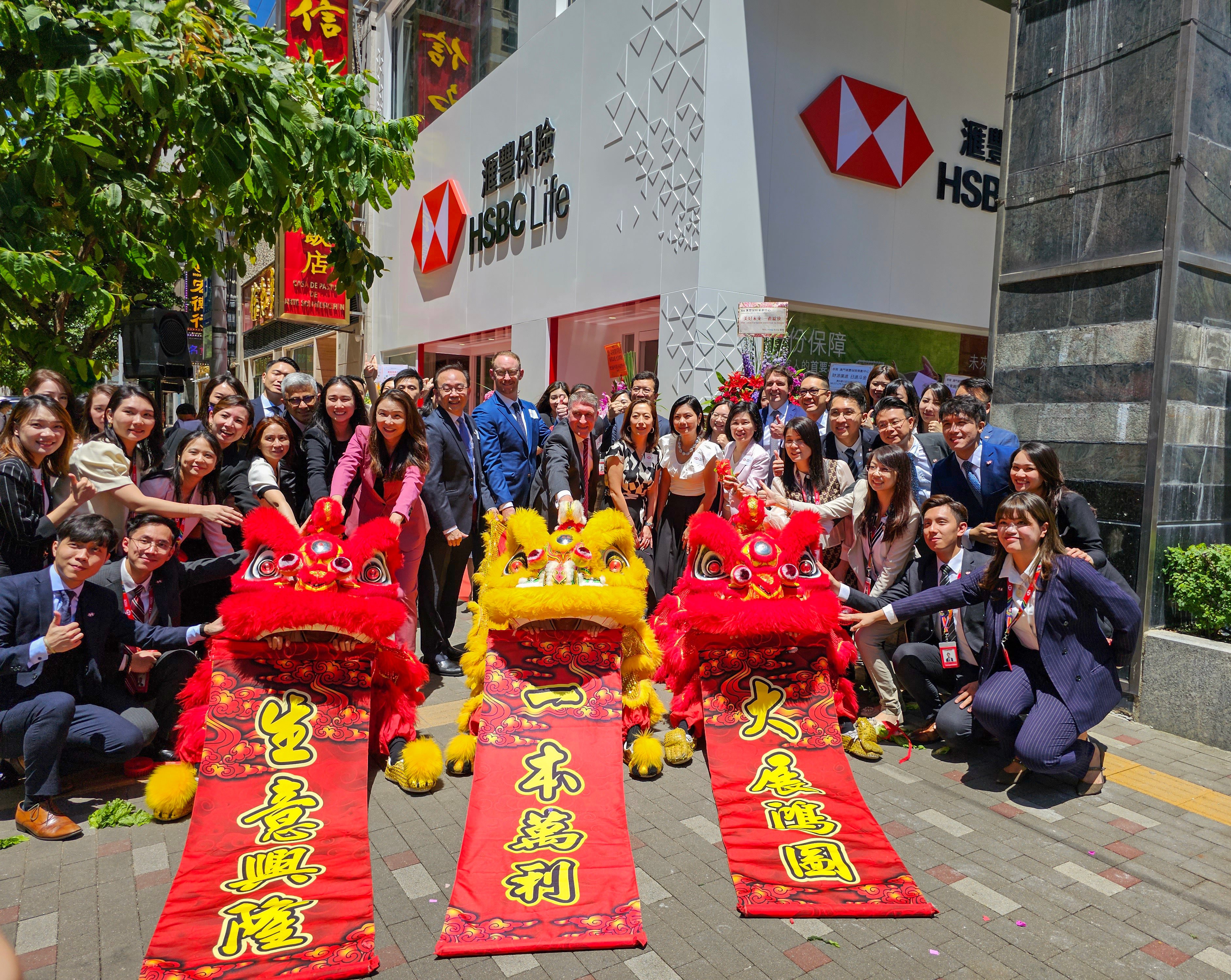 HSBC Life executives at the lion dance ceremony for its Macau centre opening on August 3, 2023. Photo: Enoch Yiu