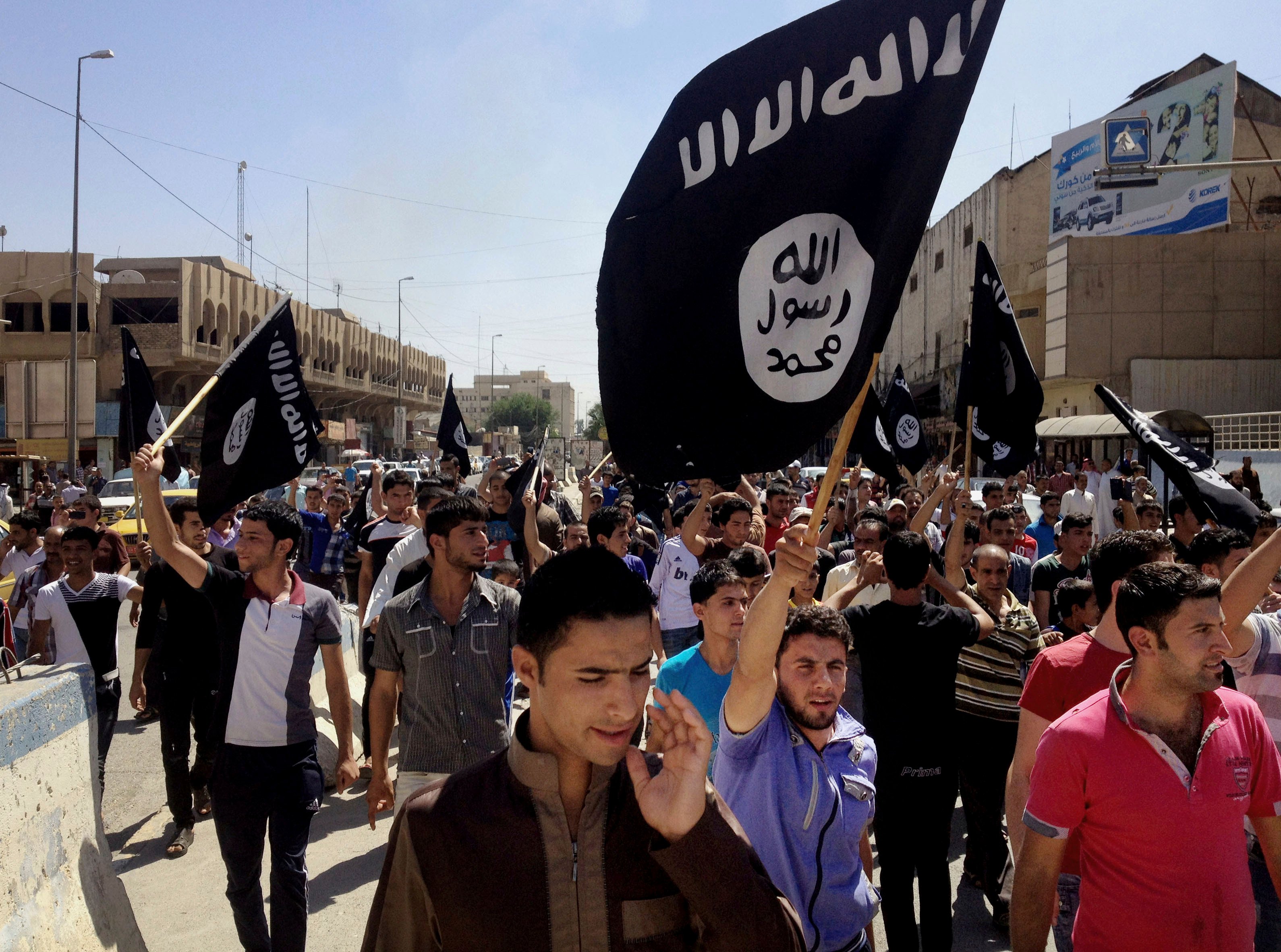 Demonstrators chant pro-Islamic State group slogans in Mosul, Iraq, in June. Photo: AP