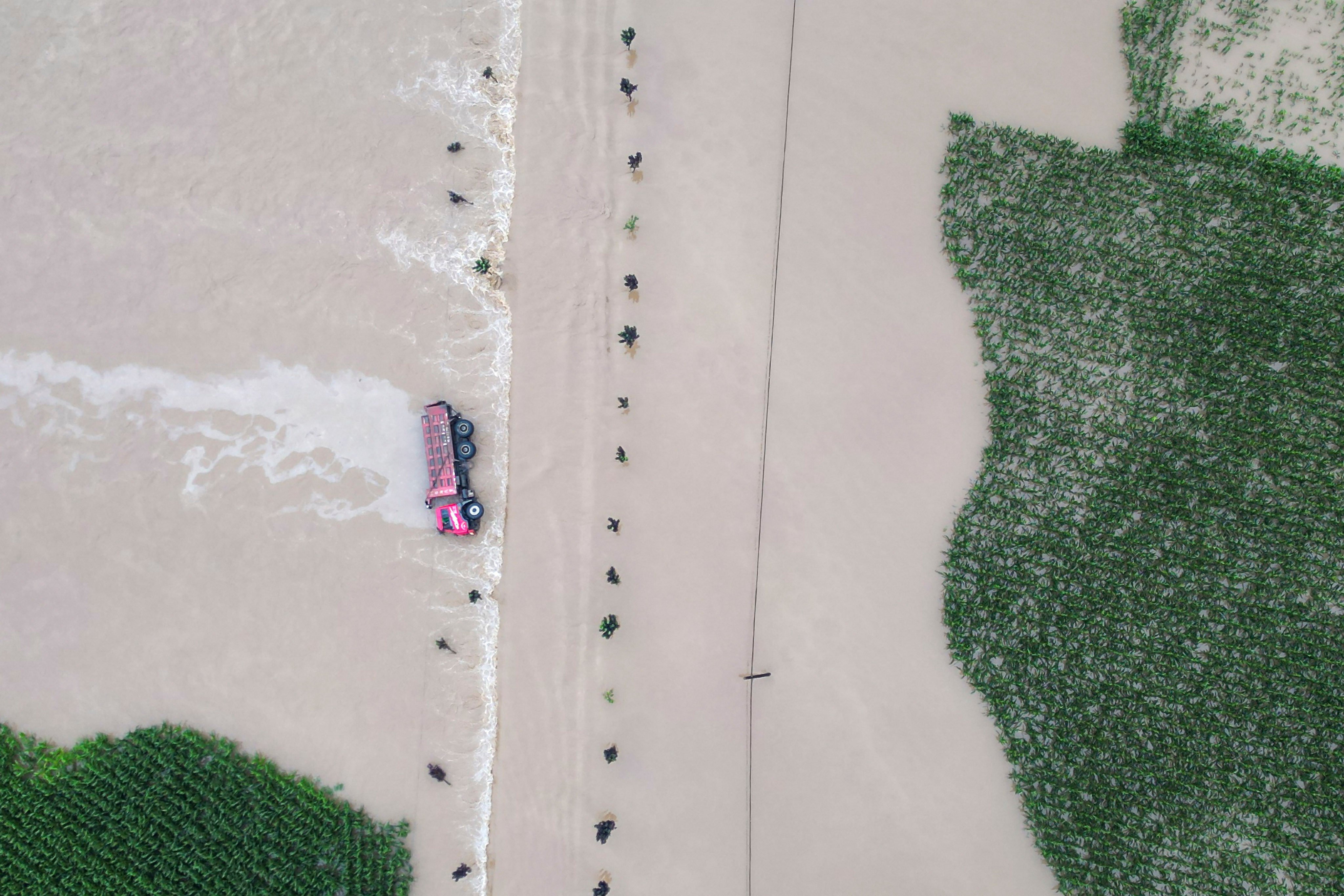 Authorities in the city of Shulan, Jilin province say their next task is to repair roads, bridges, electricity infrastructure and telecommunications stations damaged by heavy rain and floods. Photo: Xinhua via AP