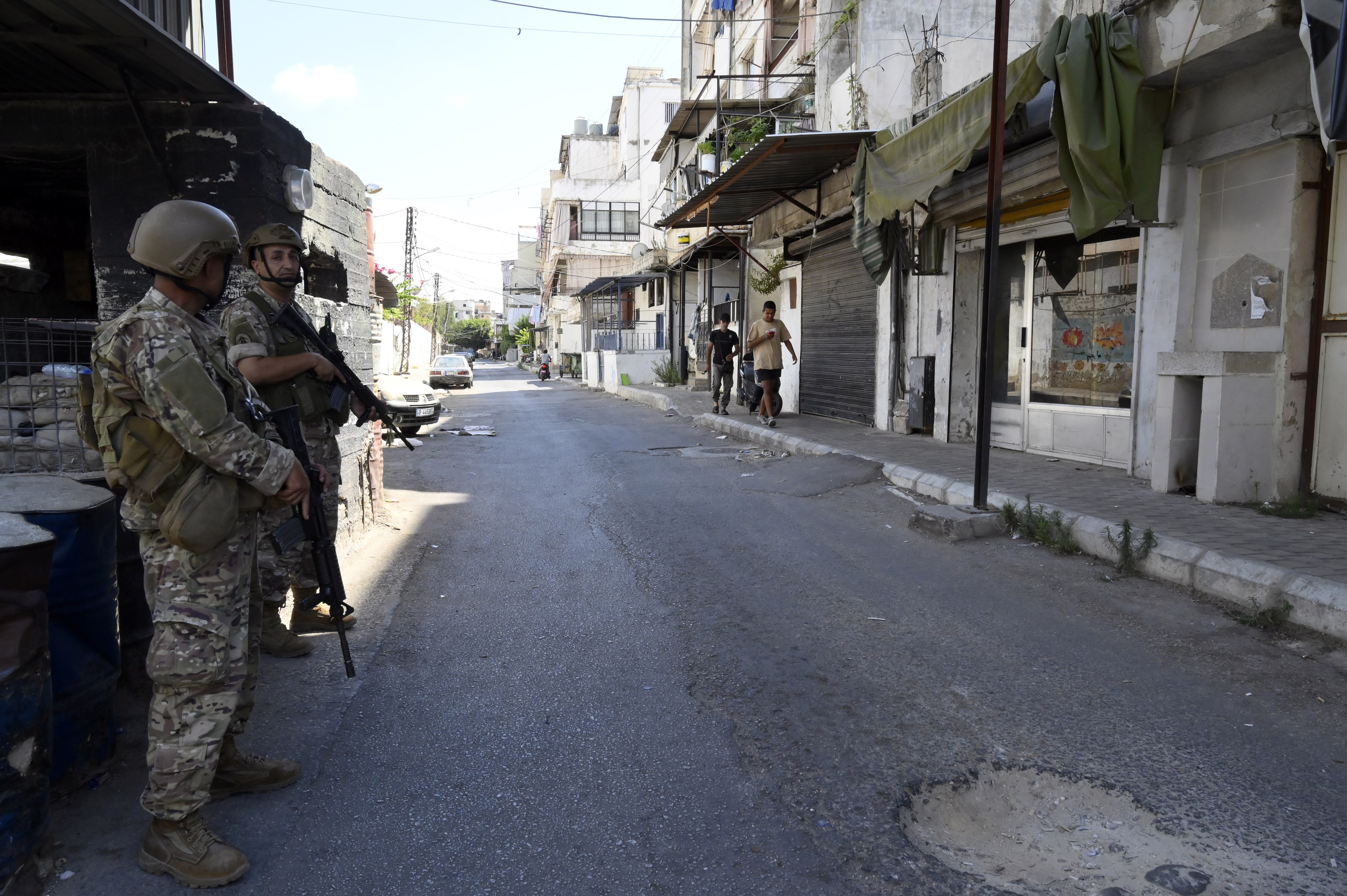 Lebanese soldiers stand guard at the entrance of Ain el-Hilweh Palestinian refugee camp during clashes between supporters of the Fatah movement and rival groups, in Sidon, Lebanon on Tuesday. Photo: EPA-EFE