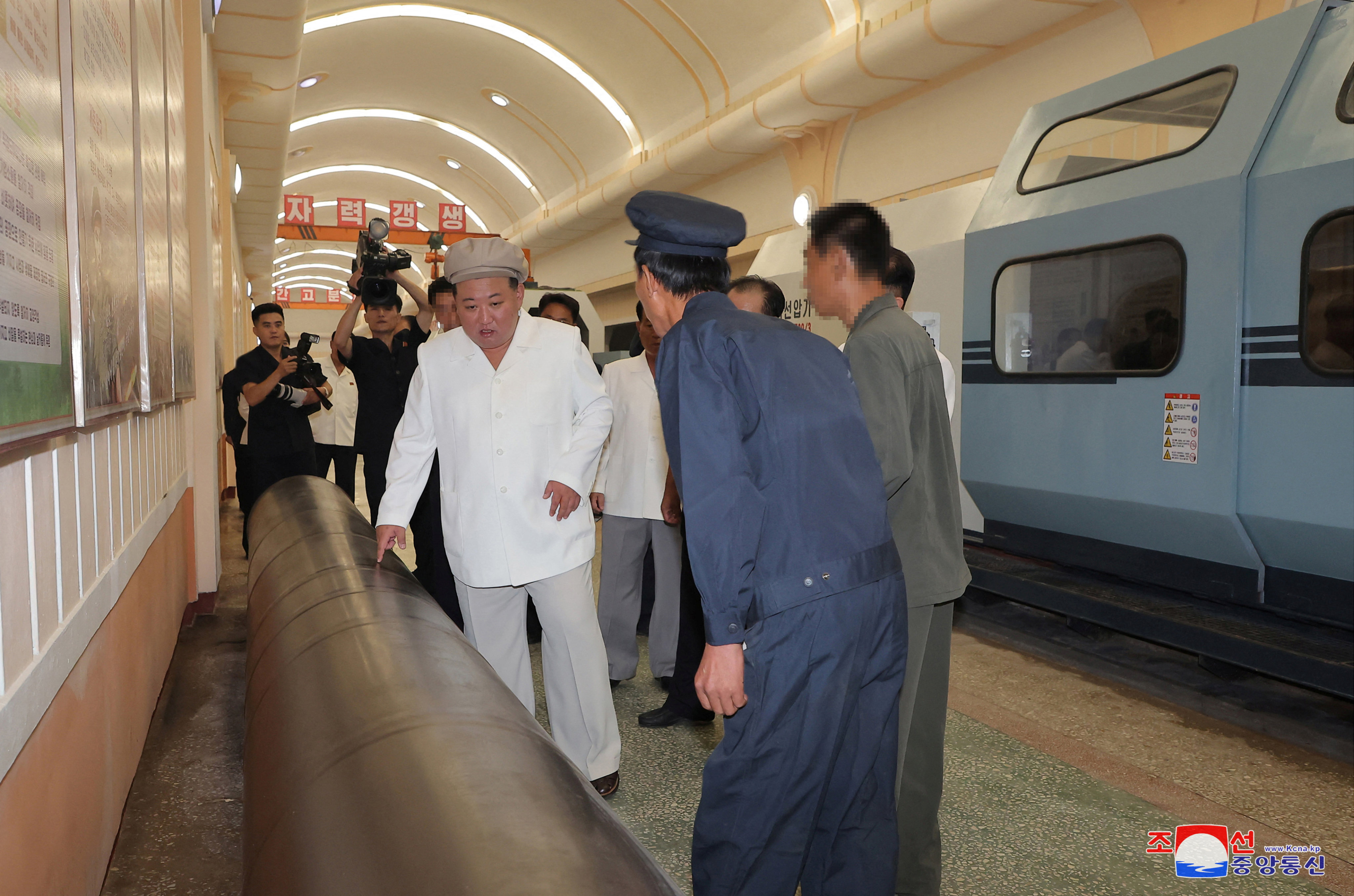 North Korean leader Kim Jong Un visiting a weapons factory on Sunday. Photo: via Reuters