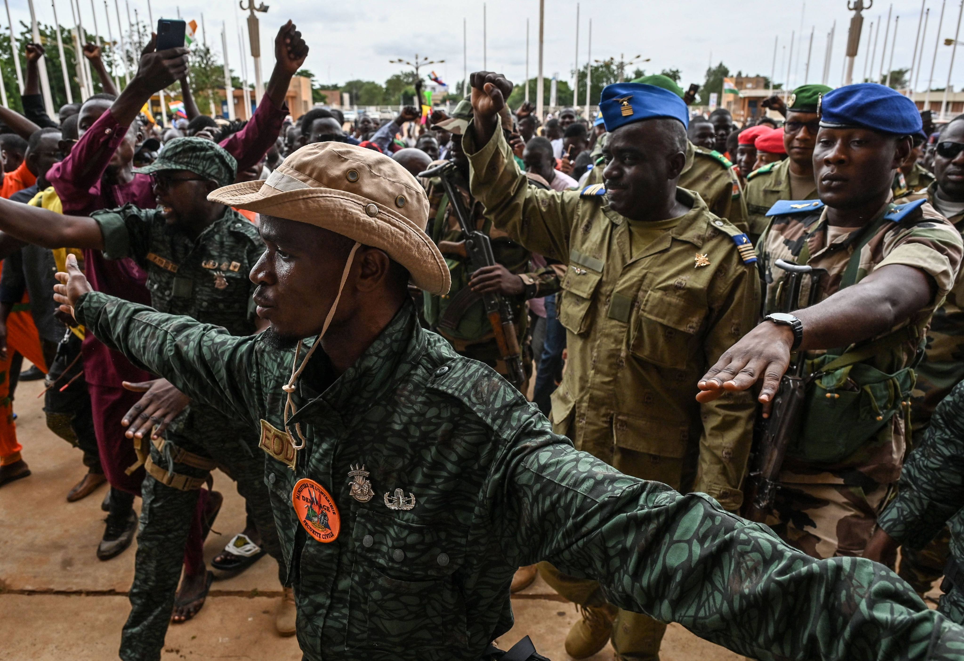 A spokesman for the coup leaders, Colonel Major Amadou Abdramane, is greeted by supporters at a stadium in Niamey on Sunday. Photo: AFP