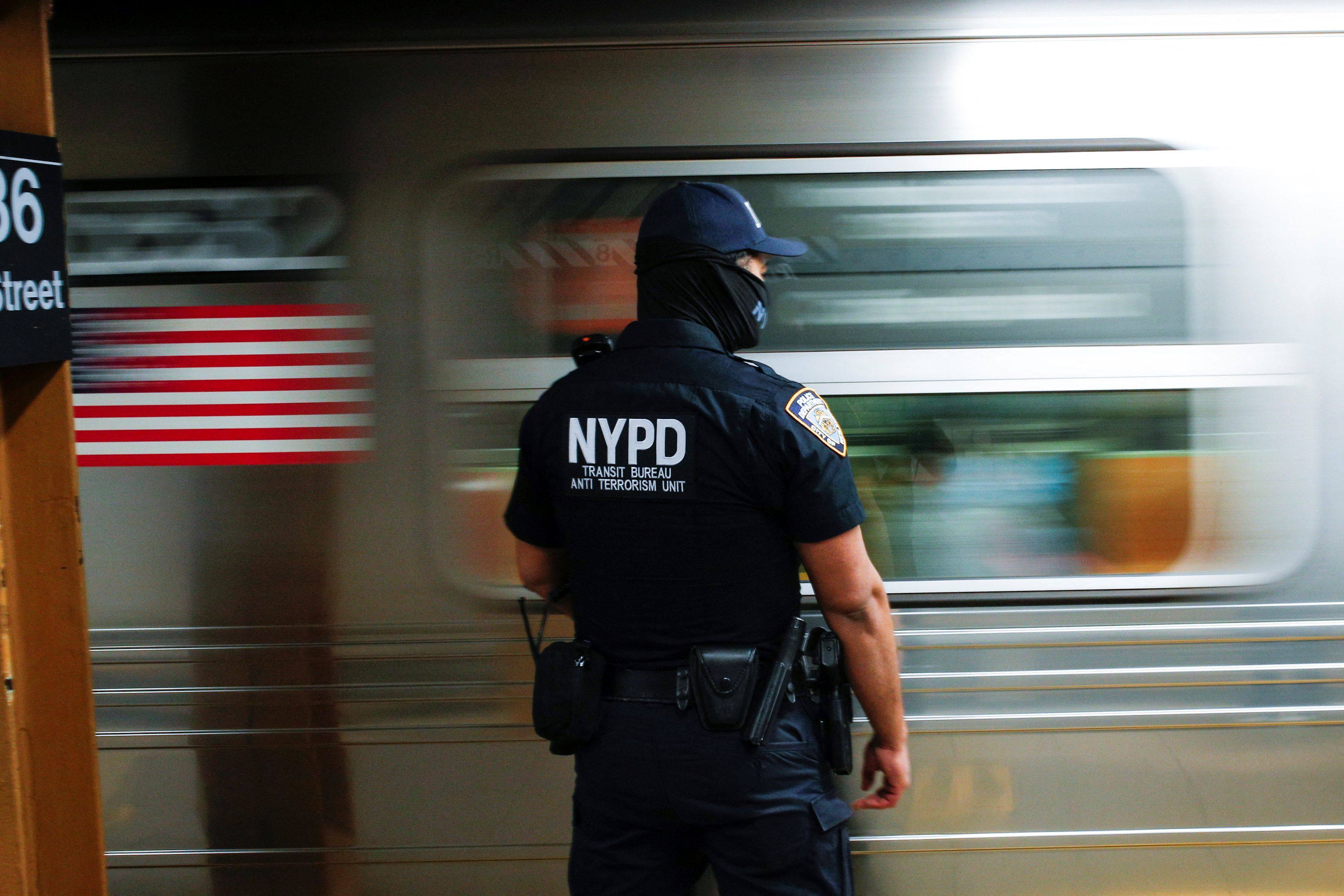 A New York police office patrols at a subway station. Photo: Reuters