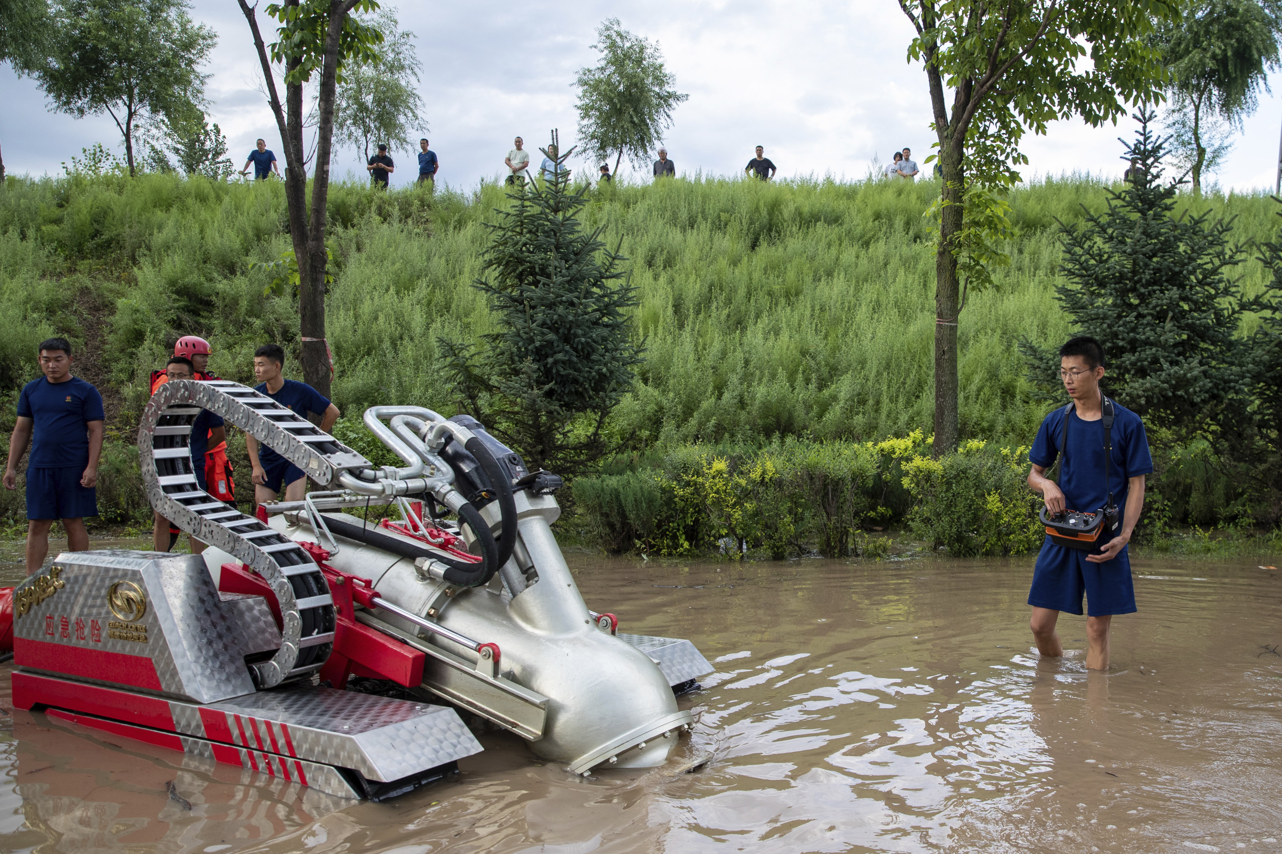 Firefighters work to combat flooding in Mudanjiang, Heilongjiang province on Saturday. Photo: Xinhua via AP