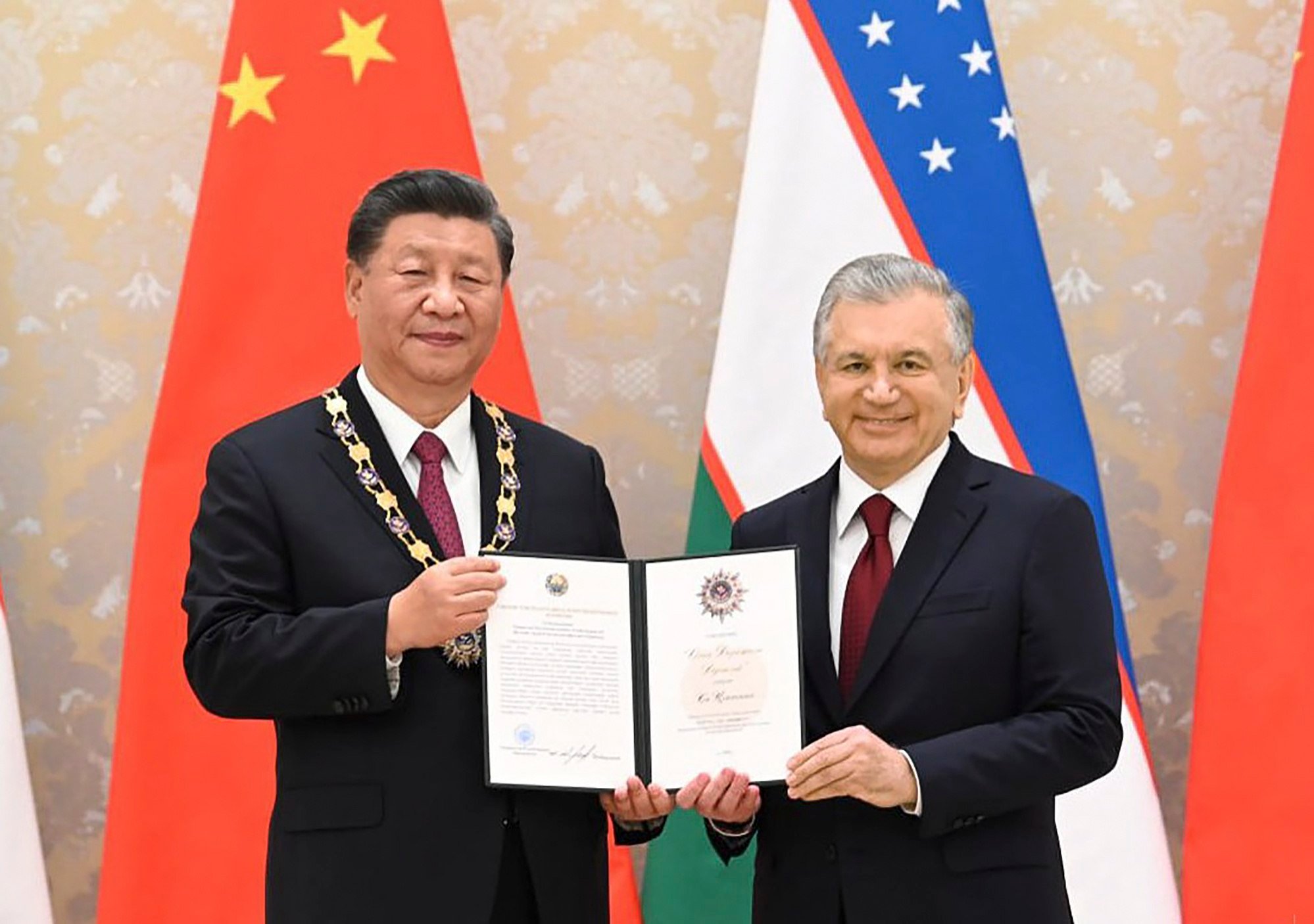 Uzbekistan President Shavkat Mirziyoyev (right) poses with President Xi Jinping after awarding him the Order of Holy Friendship before the Shanghai Cooperation Organisation summit in Samarkand, Uzbekistan, in September 2022. Bilateral trade and Chinese investment in Uzbekistan have risen steadily in recent years as Uzbekistan purses a raft of reforms in its modernisation efforts. Photo: EPA-EFE