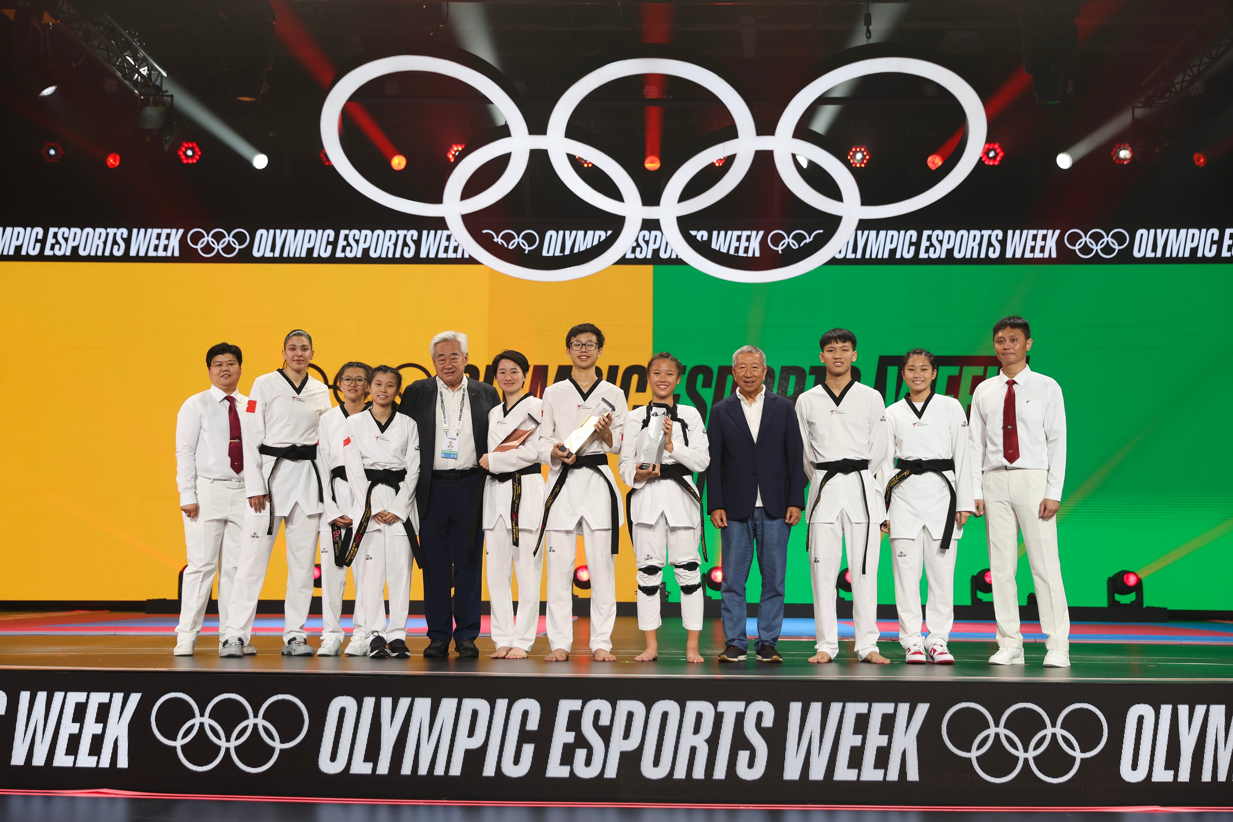 First-, second- and third-placed teams in the Virtual Taekwondo finals at the inaugural Olympic Esports Week, held at Suntec Singapore Convention Exhibition Centre in June. Photo: Getty Images