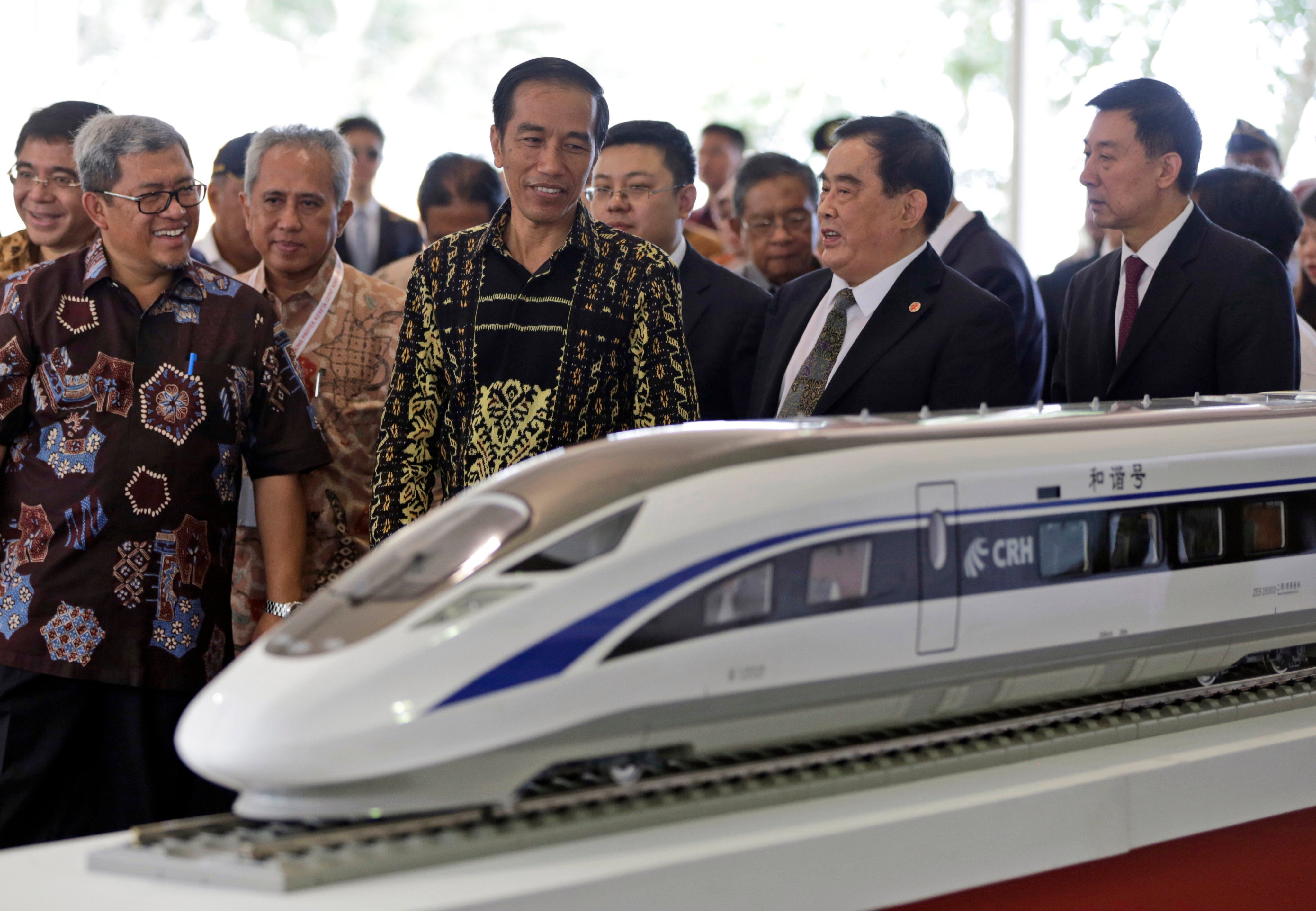 Indonesian President Joko Widodo admires a model of a Chinese high-speed train in 2016. The soft launch of the Jakarta-Bandung high-speed railway has been pushed back to September. Photo: AP