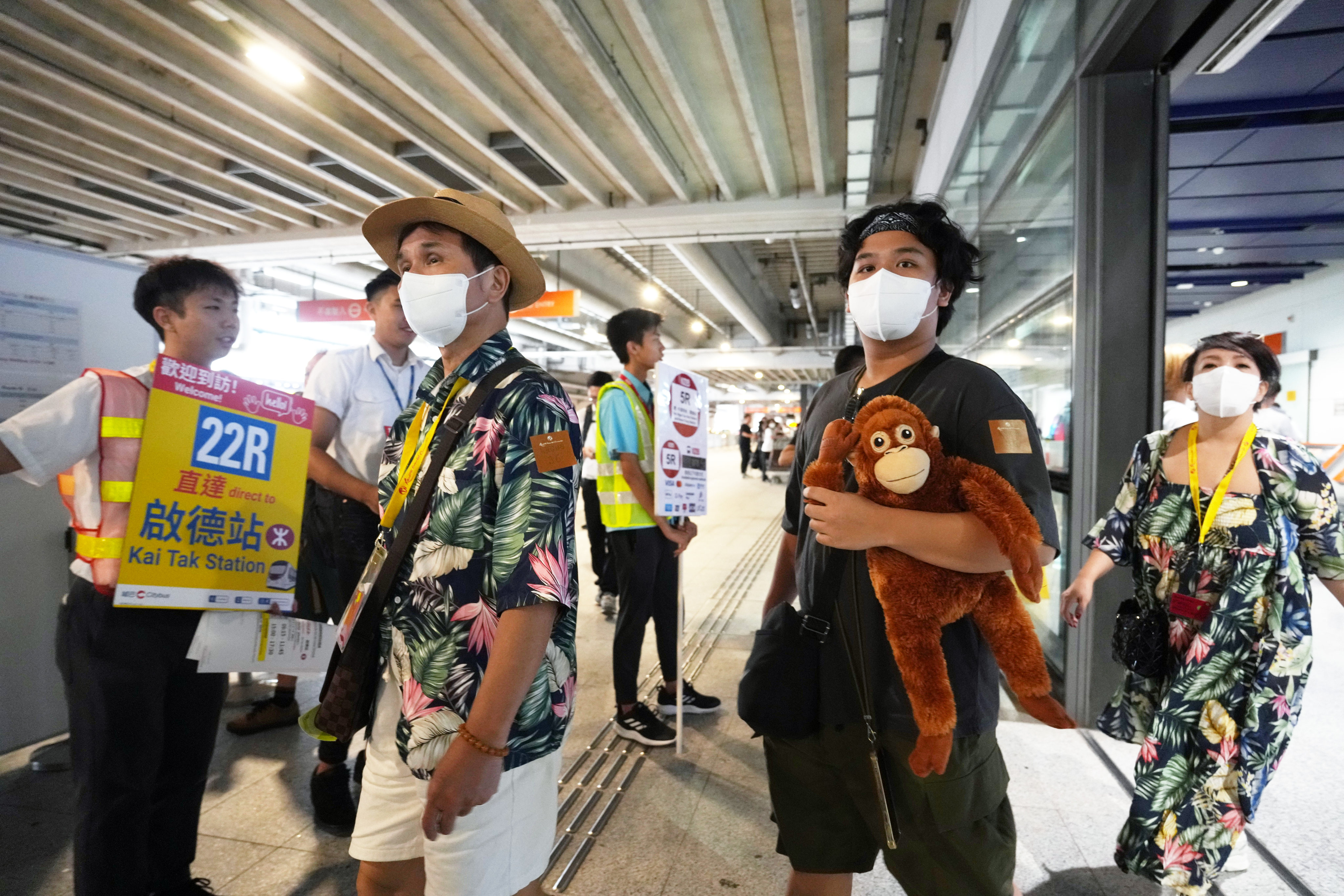 Passengers at Kai Tak Cruise Terminal are pointed in the direction of a free bus service to Kai Tak MTR station. Photo: Sam Tsang