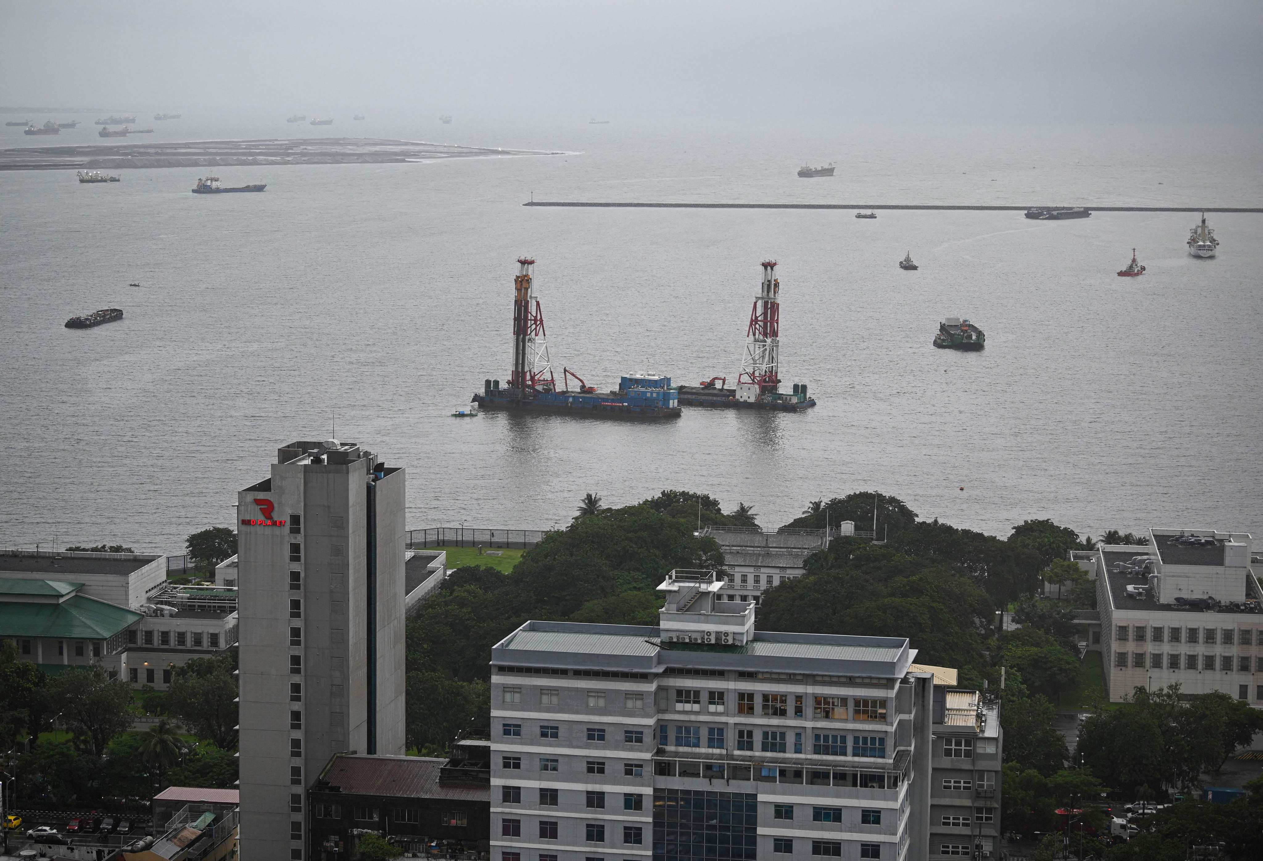 An aerial photo showing the US embassy complex (foreground) and the reclamation site (upper left) off Manila Bay. US diplomats have raised security and environmental concerns with the Philippines over the involvement of a Chinese company in a land reclamation project in Manila Bay. Photo: AFP