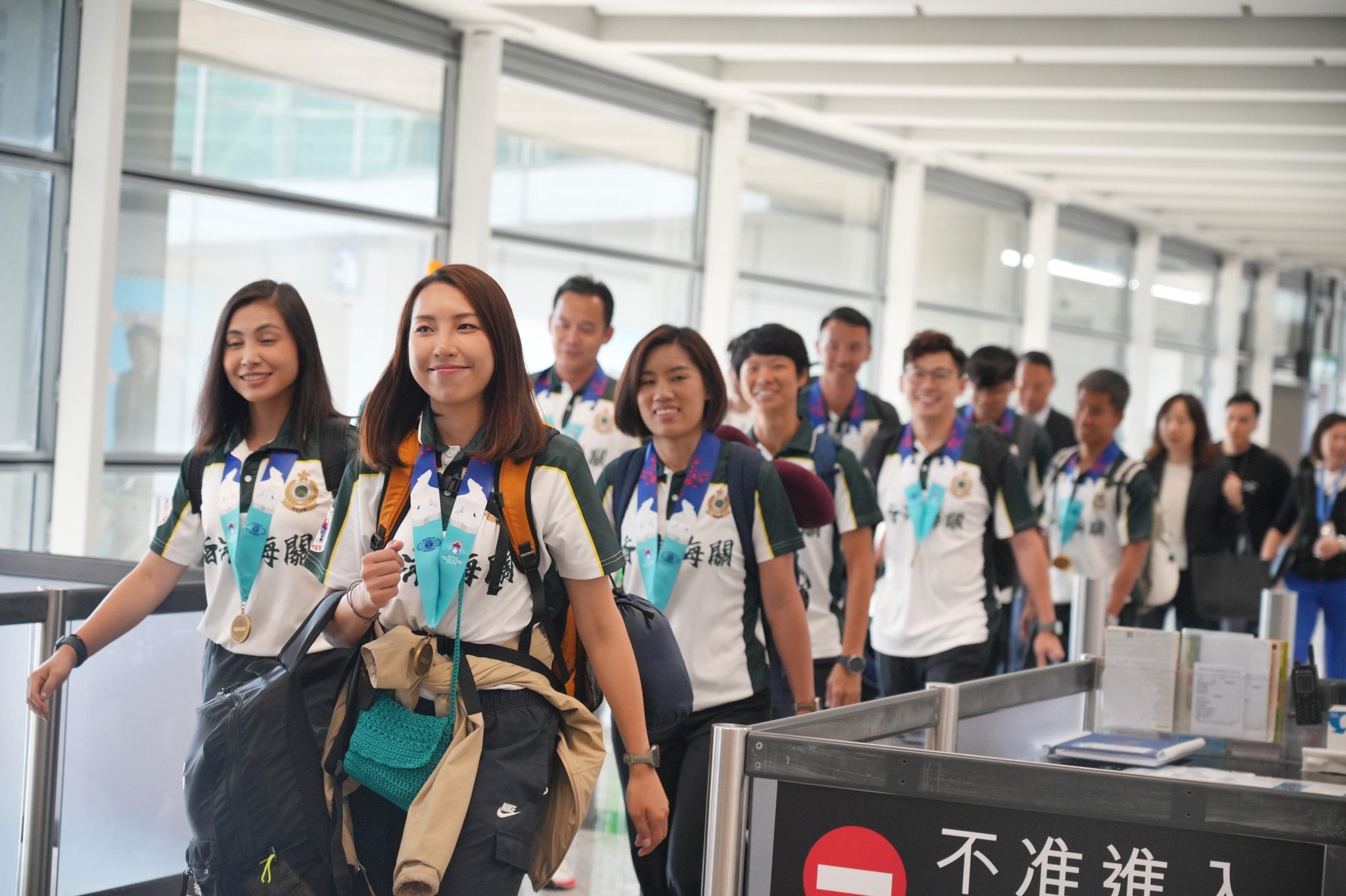 Hong Kong disciplined services athletes, who netted a record haul of medals at the World Police and Fire Games, return to the city on Tuesday. Photo: Facebook / Security Bureau
