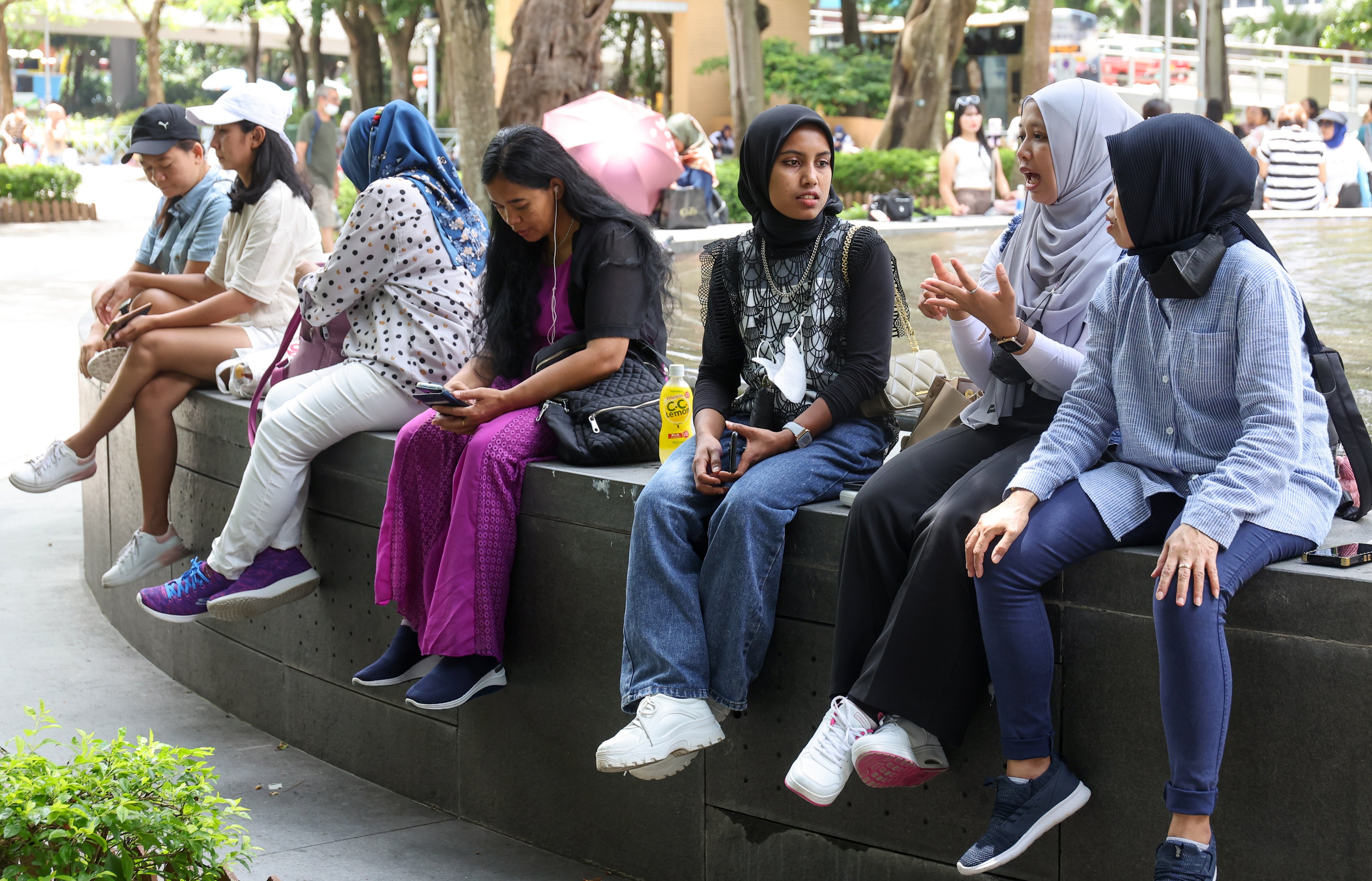 Indonesian domestic helpers spend their rest day in Mong Kok. Photo: Edmond So