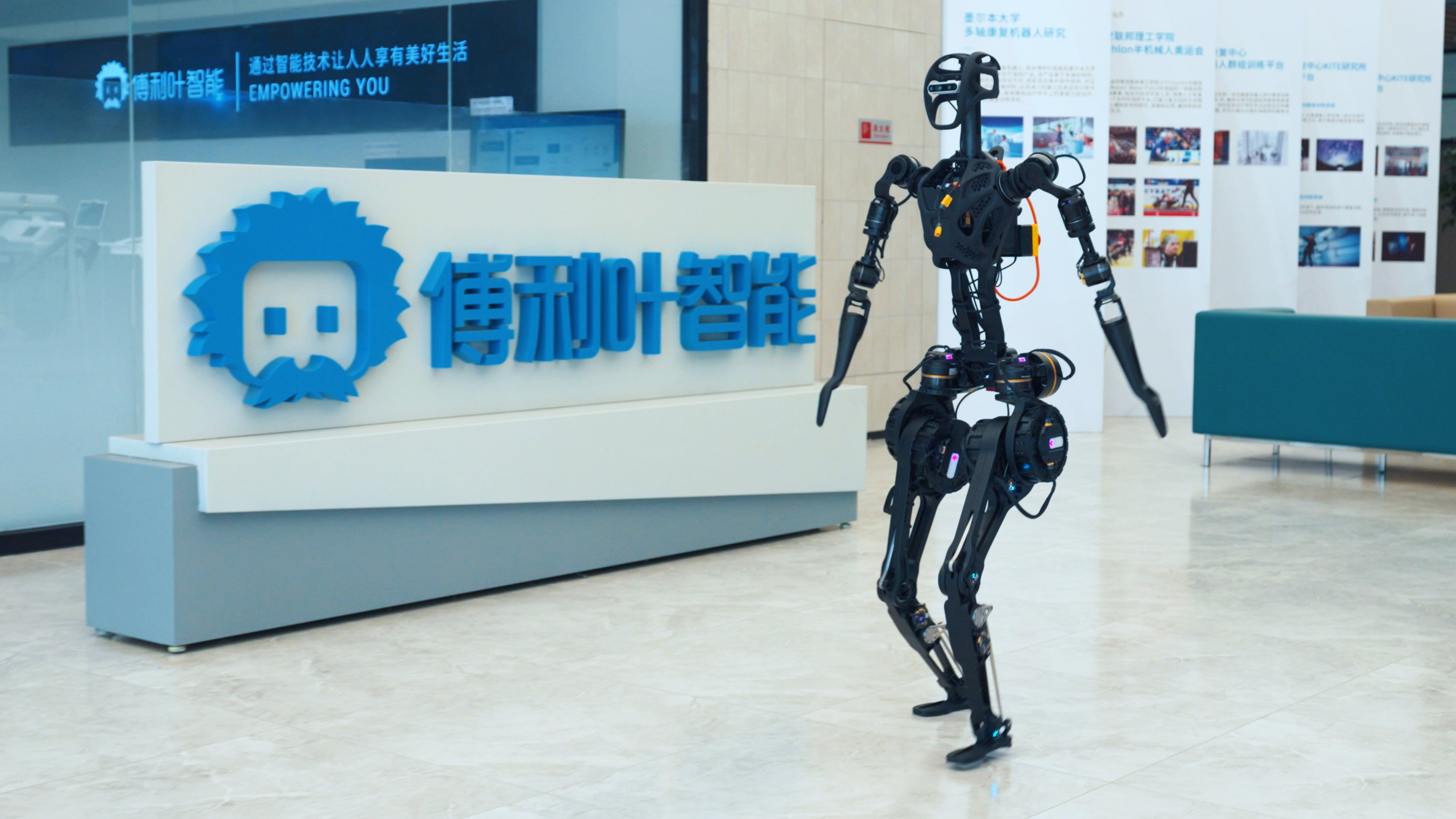 Fourier Intelligence’s GR-1 robot walks past the company logo at its headquarters in Shanghai. Photo: Handout
