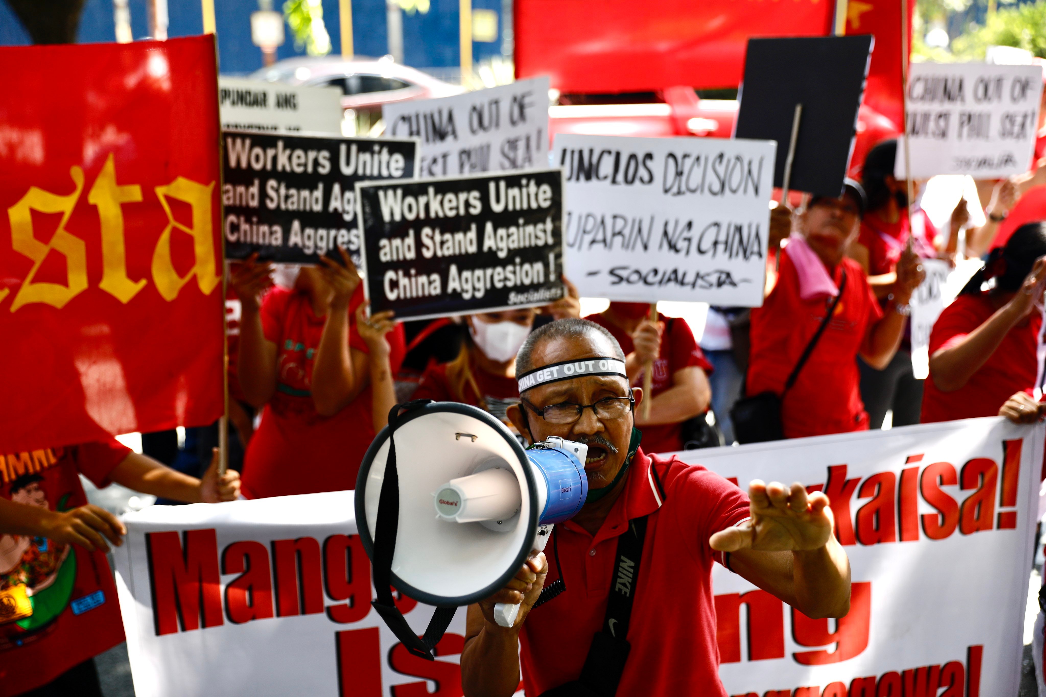 Filipino protesters demonstrate in front of the Chinese consulate office in...