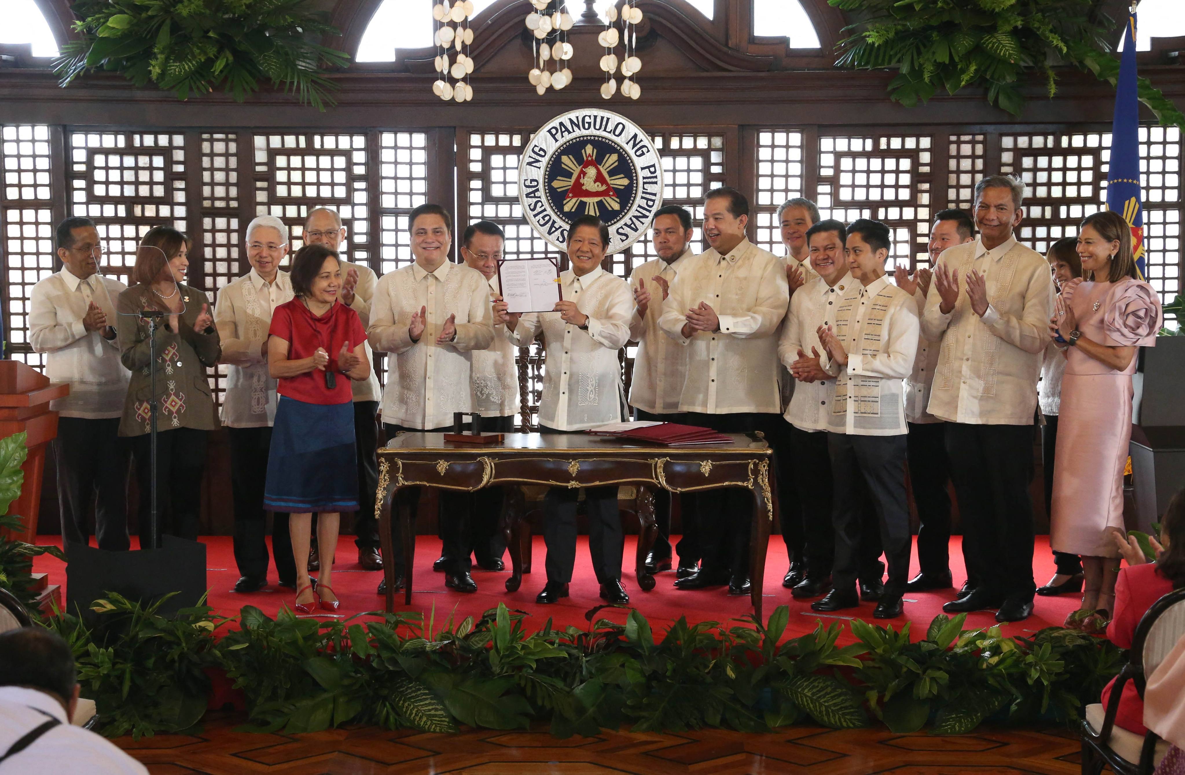 Philippines President Ferdinand Marcos Jnr (centre) after signing the Maharlika sovereign wealth fund into law at the Malacanang Palace in Manila. Photo: Philippines Presidential Photographers Association/AFP