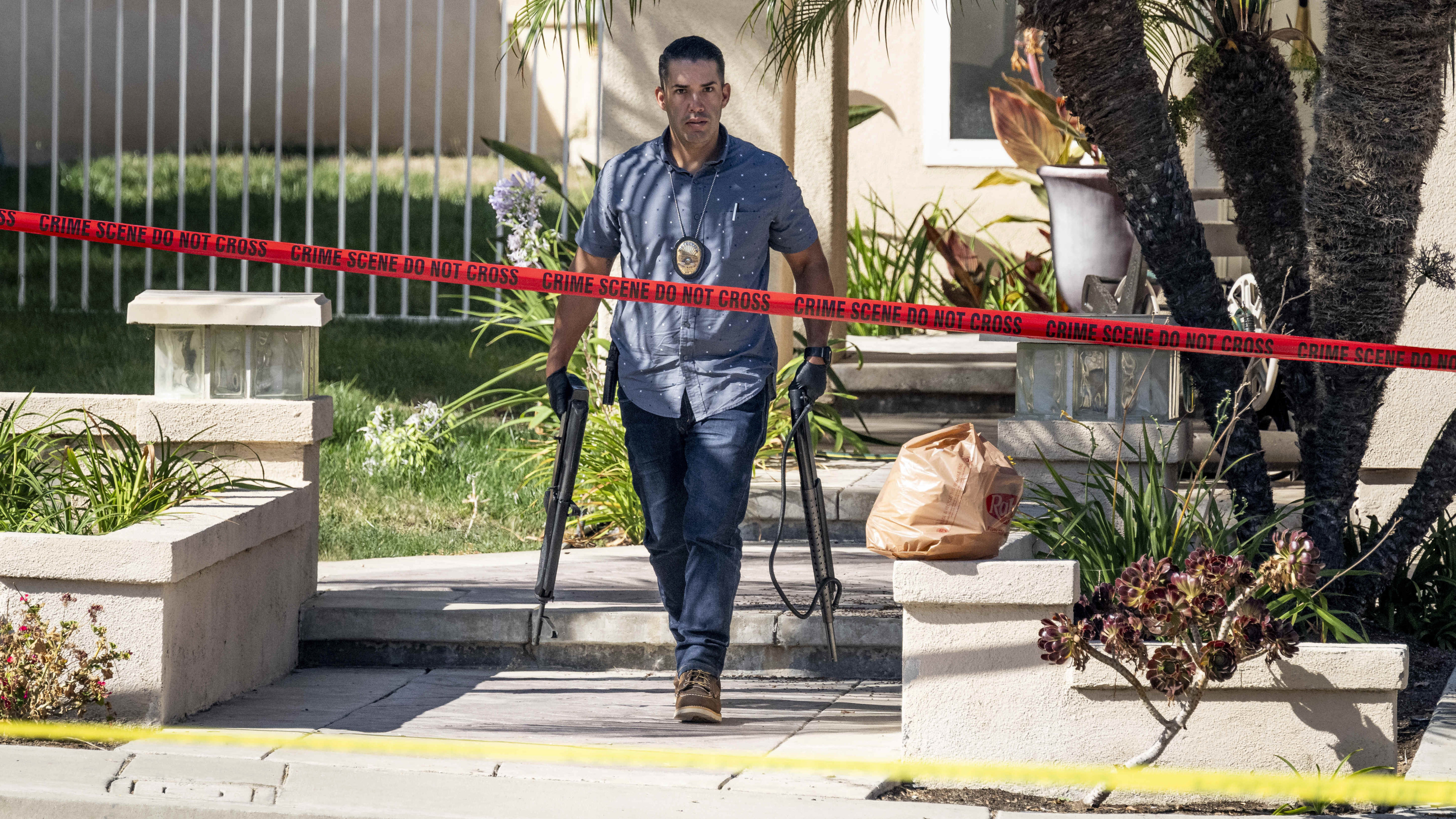 Investigators remove firearms from judge Jeffrey Ferguson’s house in Anaheim, California, on August 4. Photo: The Orange County Register via AP