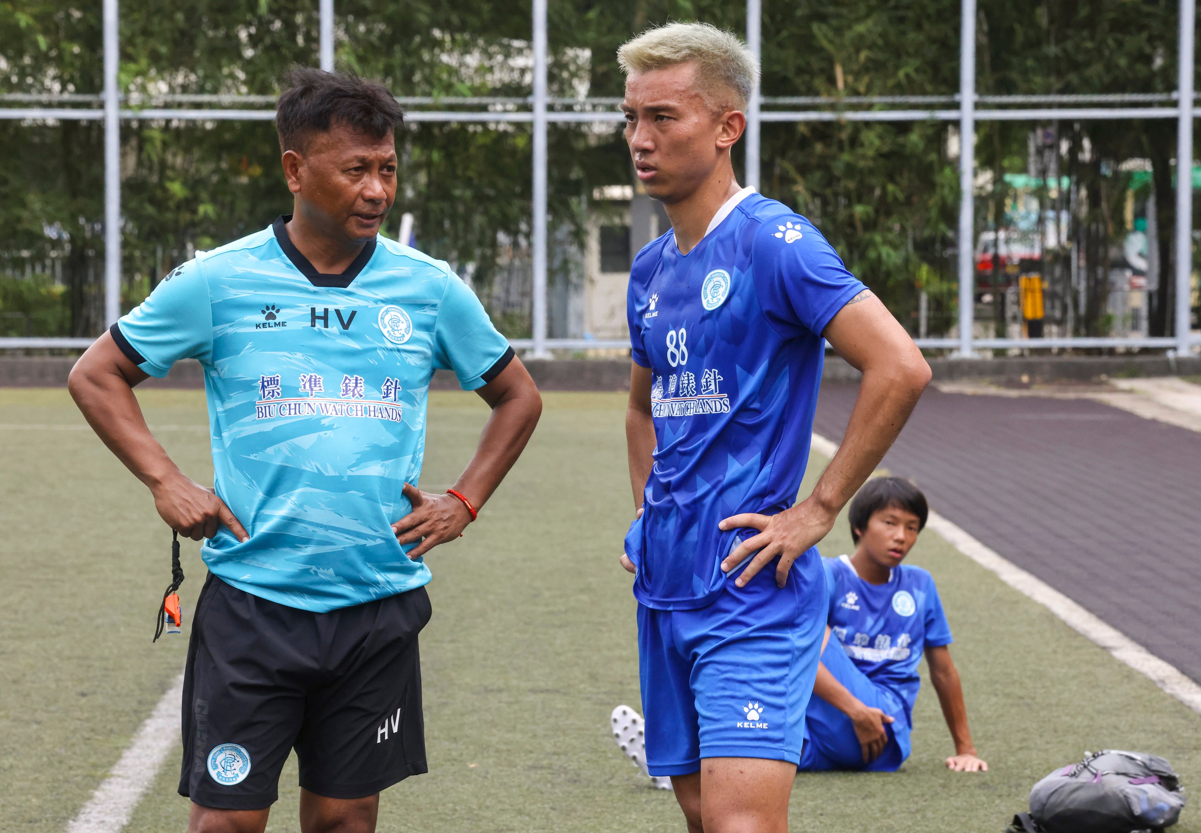 BC Rangers coach Henry Vom discusses tactics with defender Li Ngai-ho at a training session ahead of Tuesday’s clash with Haiphong. Photo: Jonathan Wong
