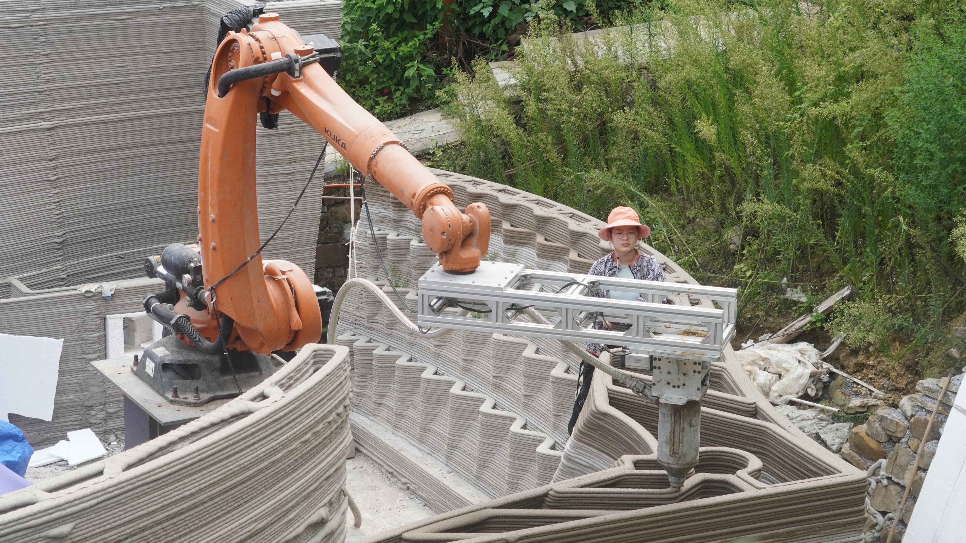 Concrete mixture is pumped through a 3D printer mounted on a robot to build new walls for a traditional rural house in Nanlong village, in China’s Guizhou province, as part of a University of Hong Kong team’s efforts to revitalise structures in the village. Photo: John Lin and Lidia Ratoi