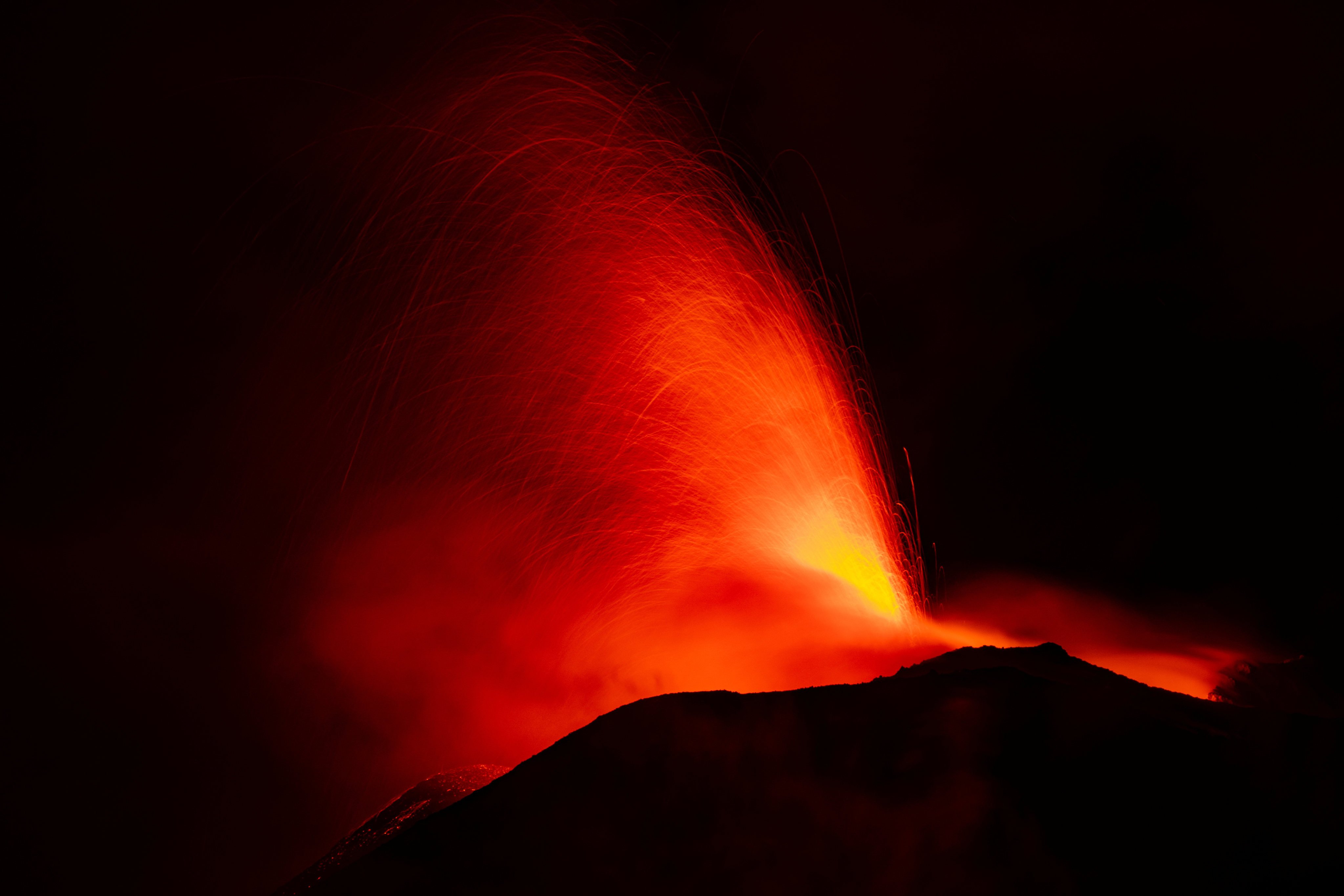 Mount Etna, Europe’s most active volcano, lights up the night sky with eruptions as seen from Rocca Della Valle, Italy on Monday. Photo: Etna Walk / Marco Restivo / Handout via Reuters