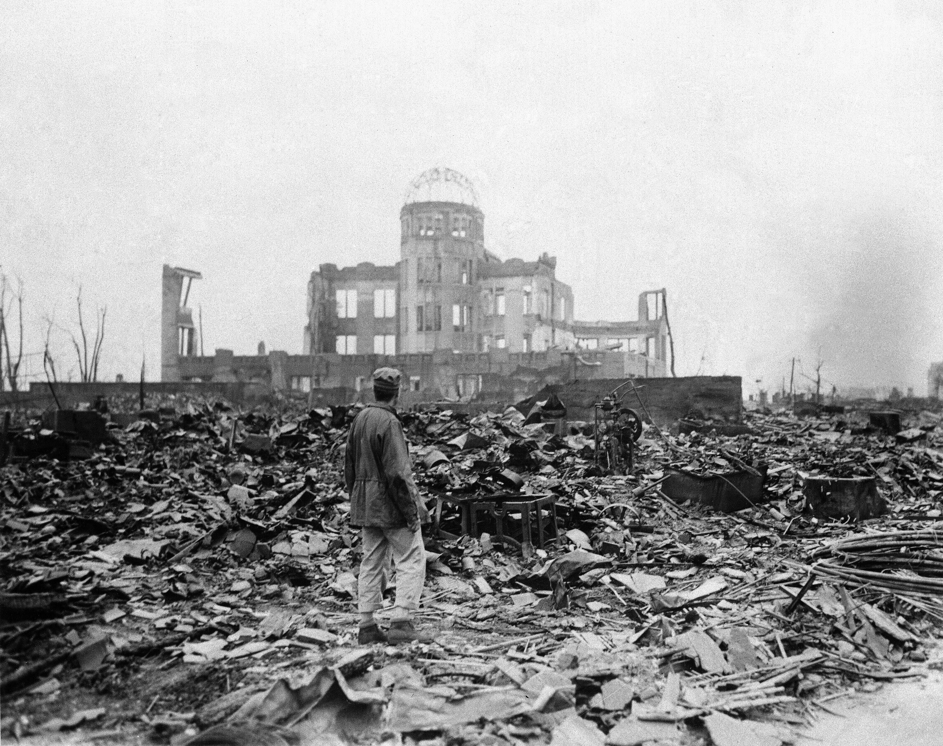 An Allied correspondent stands in a sea of rubble before the shell of a building that once was a movie theatre in Hiroshima in Japan on September 8, 1945, a month after the first atomic bomb ever used in warfare was dropped by the US to hasten Japan’s surrender. Most of those with severe radiation symptoms died within three to six weeks. Others who lived beyond that developed health problems related to burns and radiation-induced cancers and other illnesses. Photo: AP 