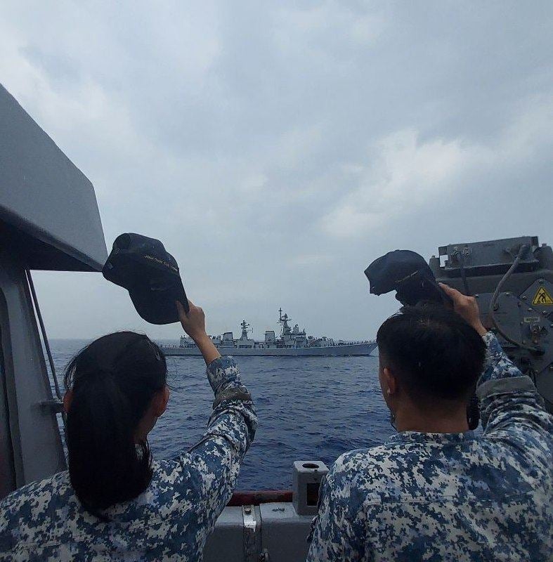 Singaporean sailors wave as India’s INS Delhi sails past Singapore’s RSS Supreme at the weeklong Asean-India Maritime Exercise earlier this year. Photo: Facebook / Singapore Navy