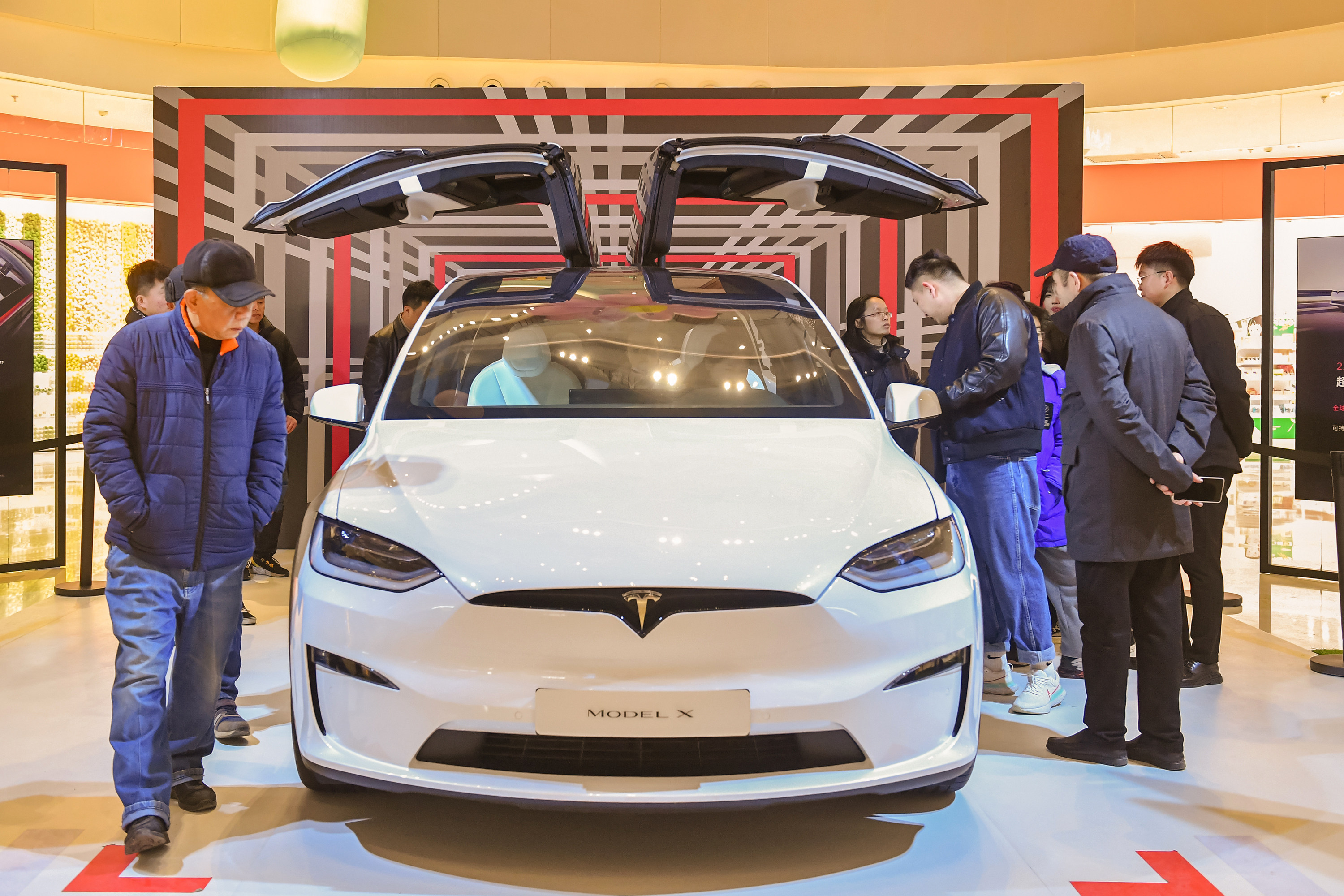 Consumers look at the Tesla Model X Plaid car at Vanke Mall on February 26, 2023 in Hefei, Anhui Province of China. Photo: Getty Images