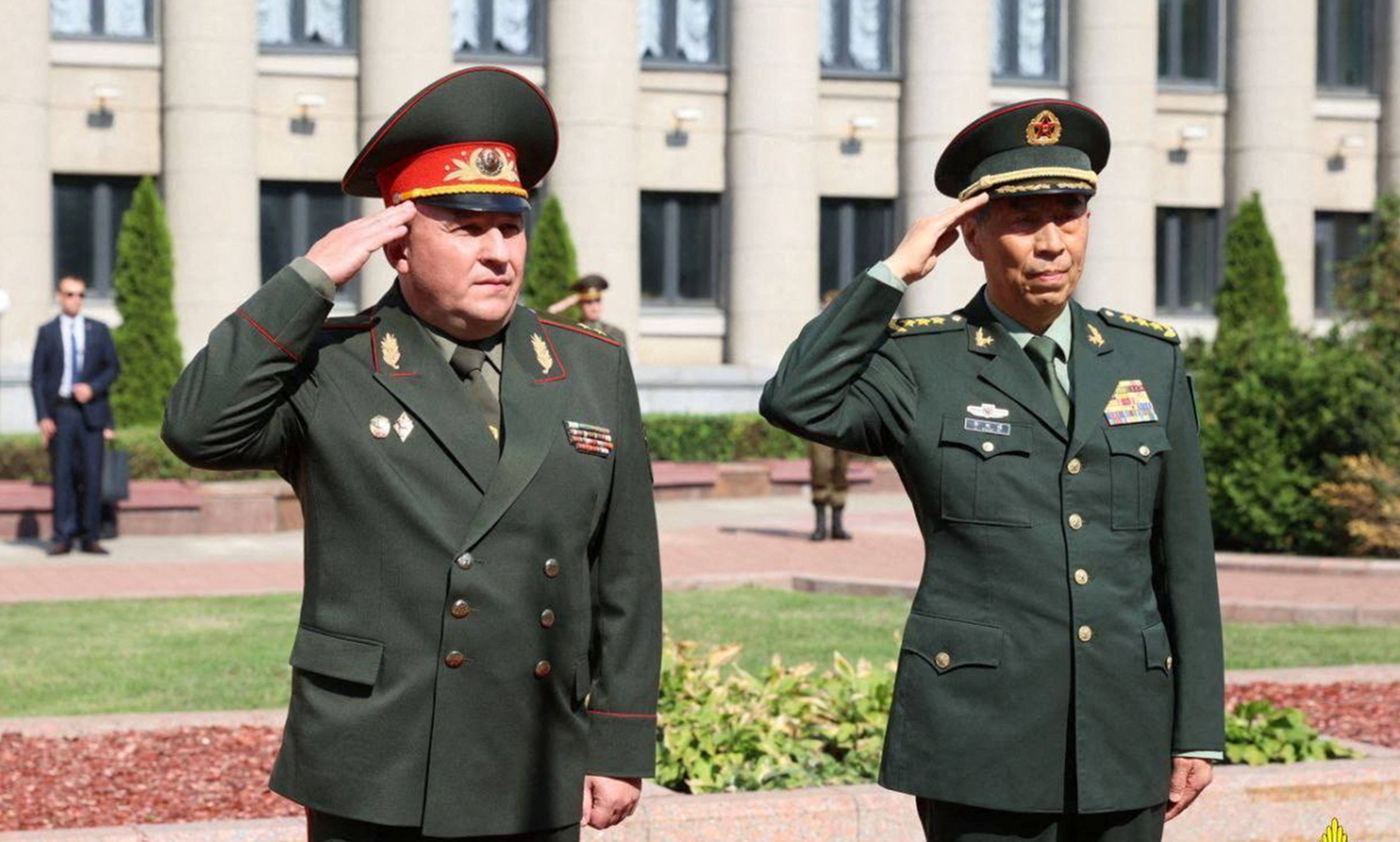 Belarusian defence minister Viktor Khrenin (left) and his Chinese counterpart General Li Shangfu in Minsk on Wednesday. Photo: Reuters