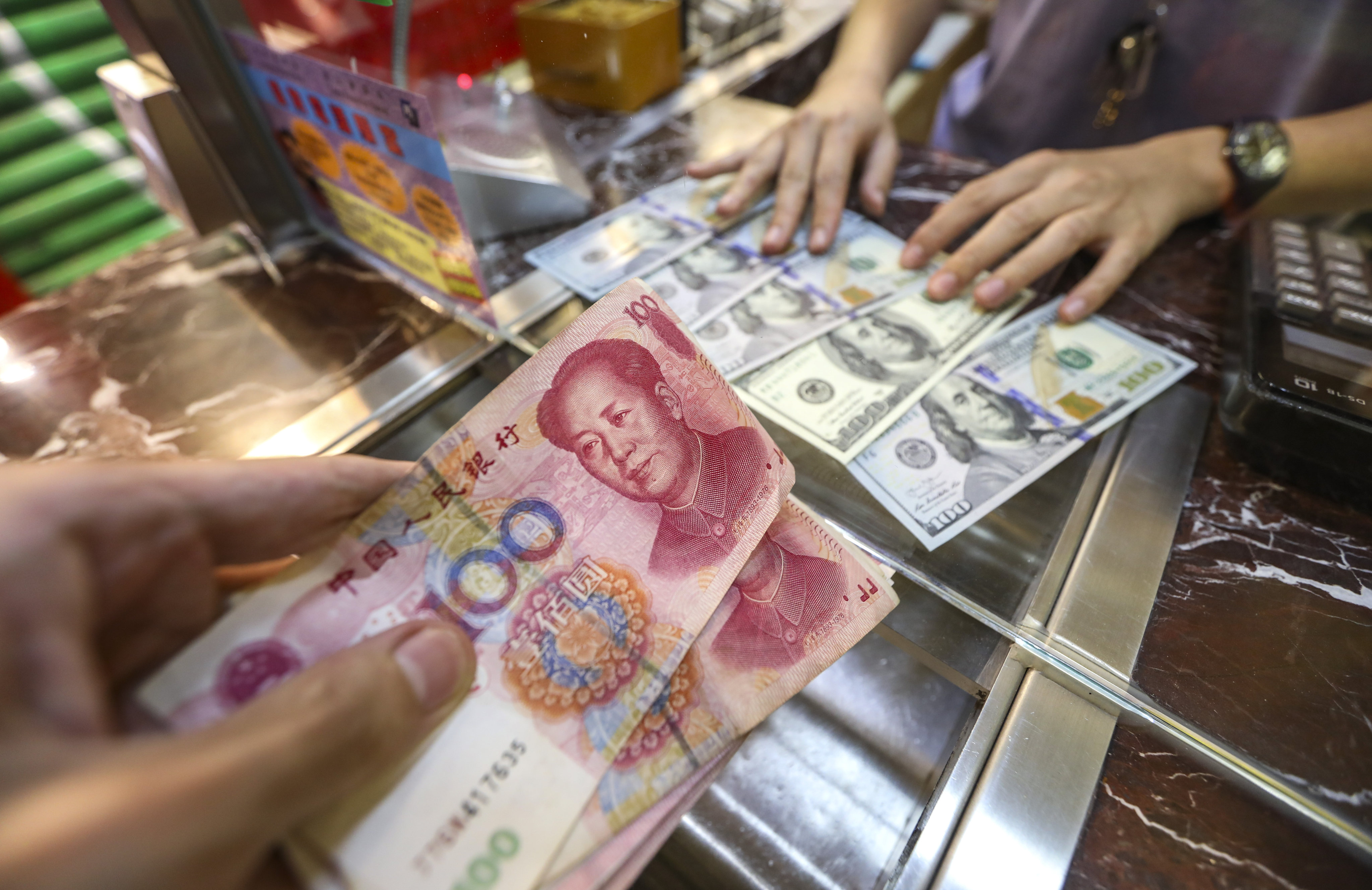 The yuan is around 6.9 per cent weaker against the US dollar than it was a year ago. Photo: Roy Issa